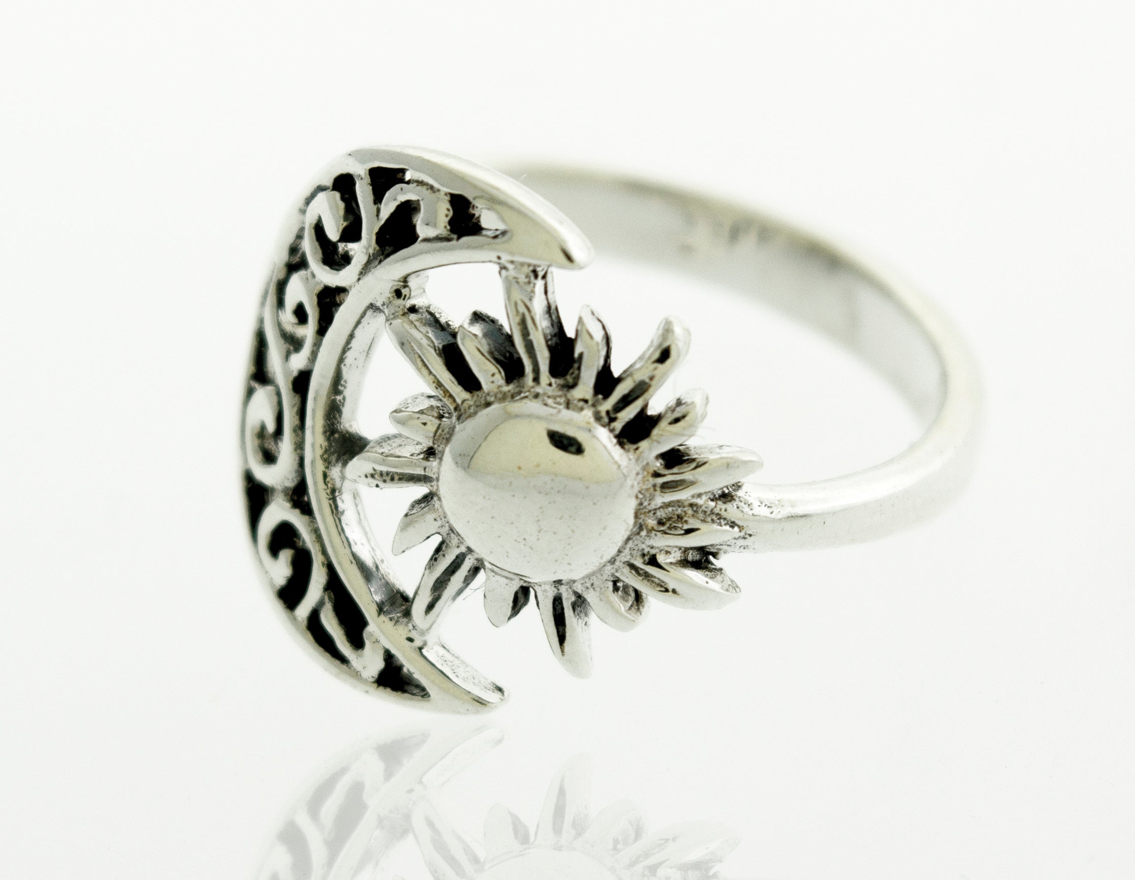A boho silver Moon And Sun Ring With Swirl Design.