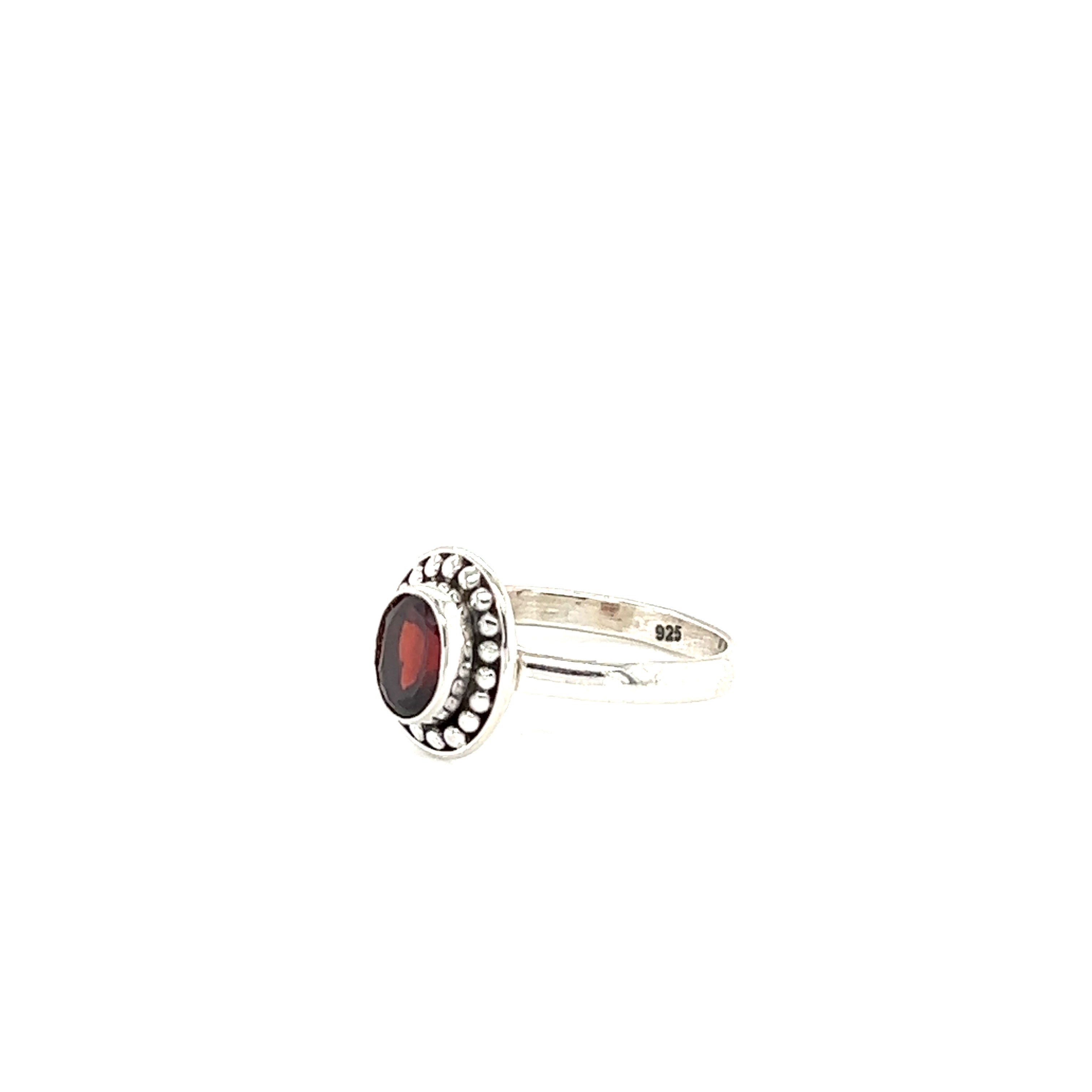 A sterling silver Oval Gemstone Ring with Ball Disk Border, perfect for the boho style.