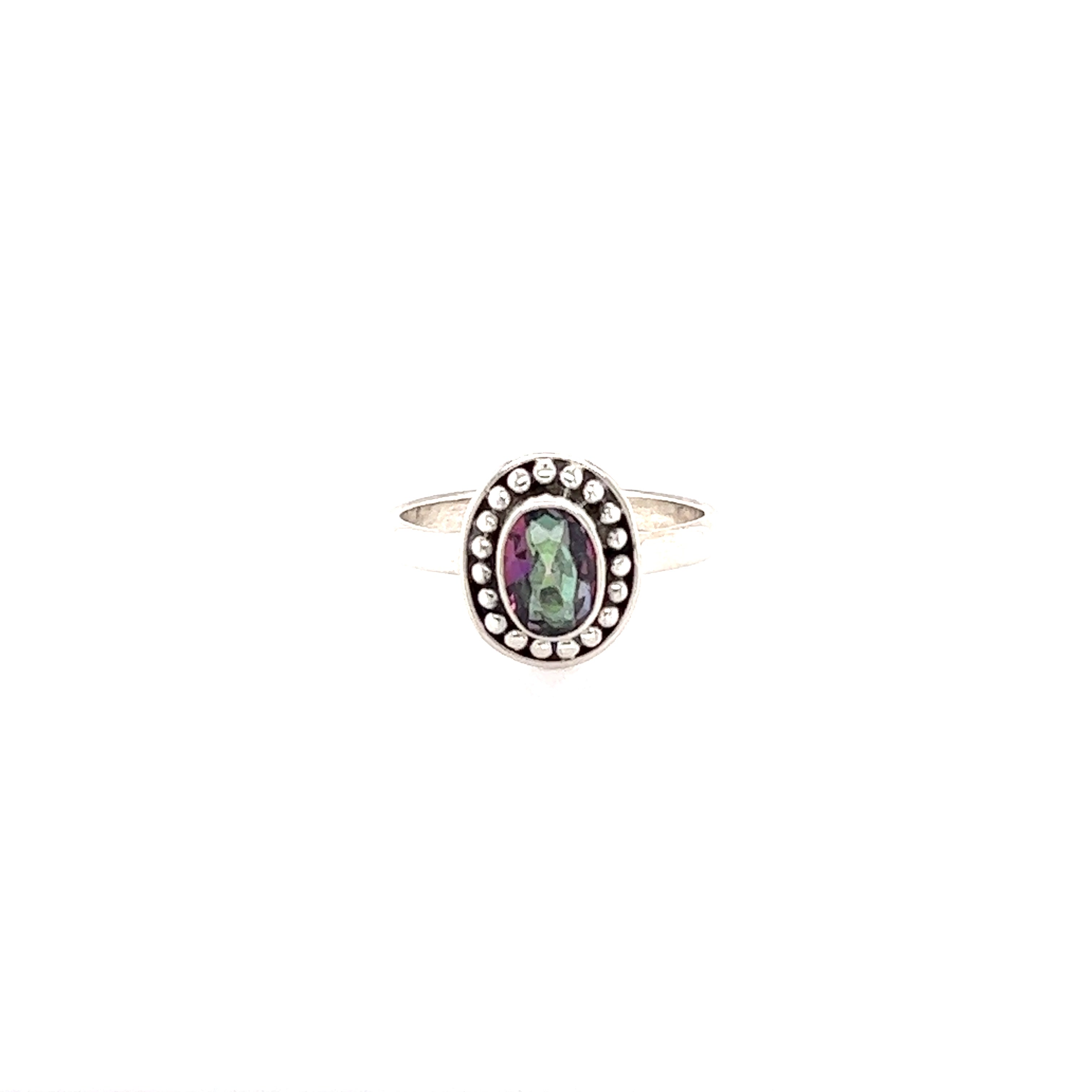 A Oval Gemstone Ring with Ball Disk Border with a black stone and diamonds.