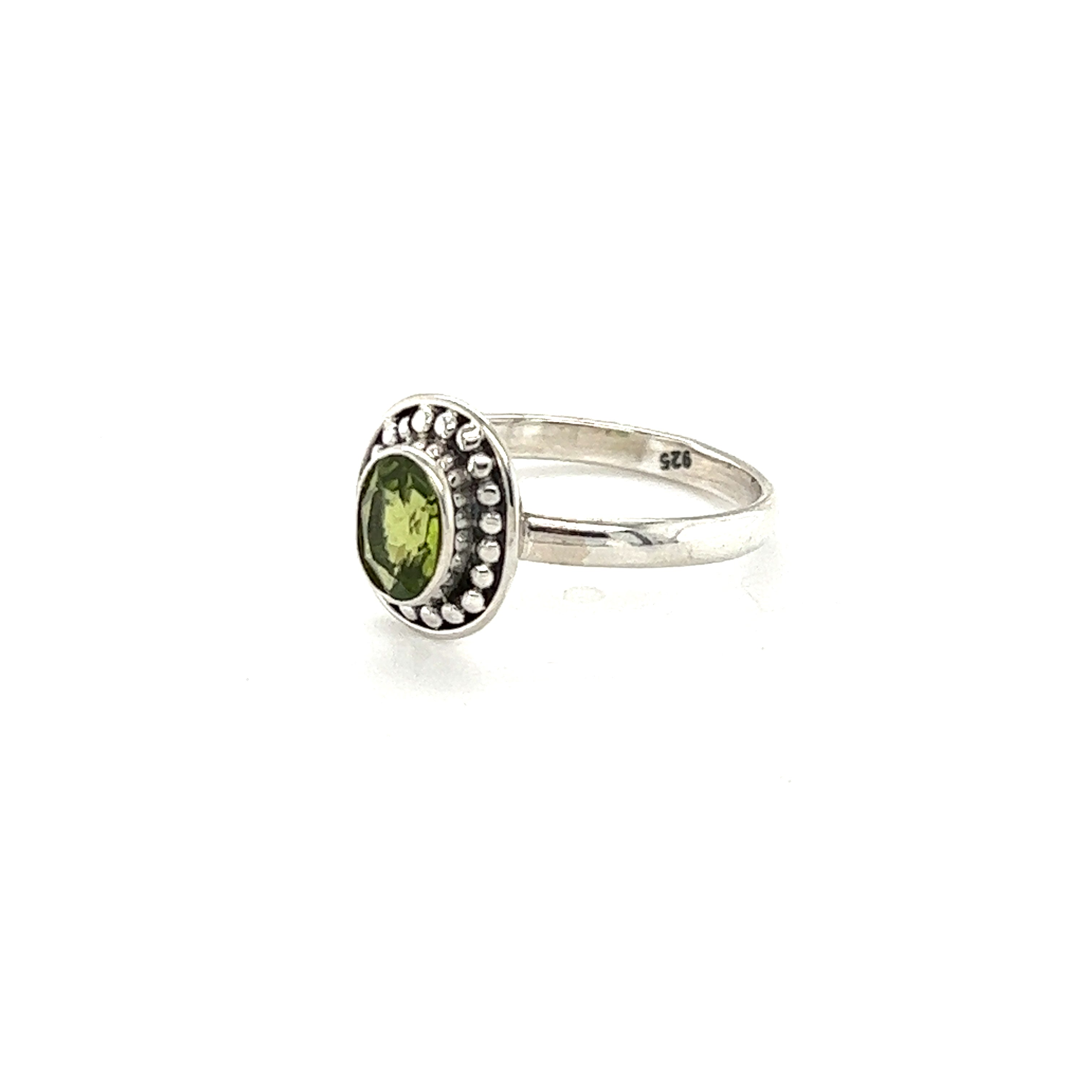 An Oval Gemstone Ring with Ball Disk Border, perfect for the boho and hippie style.