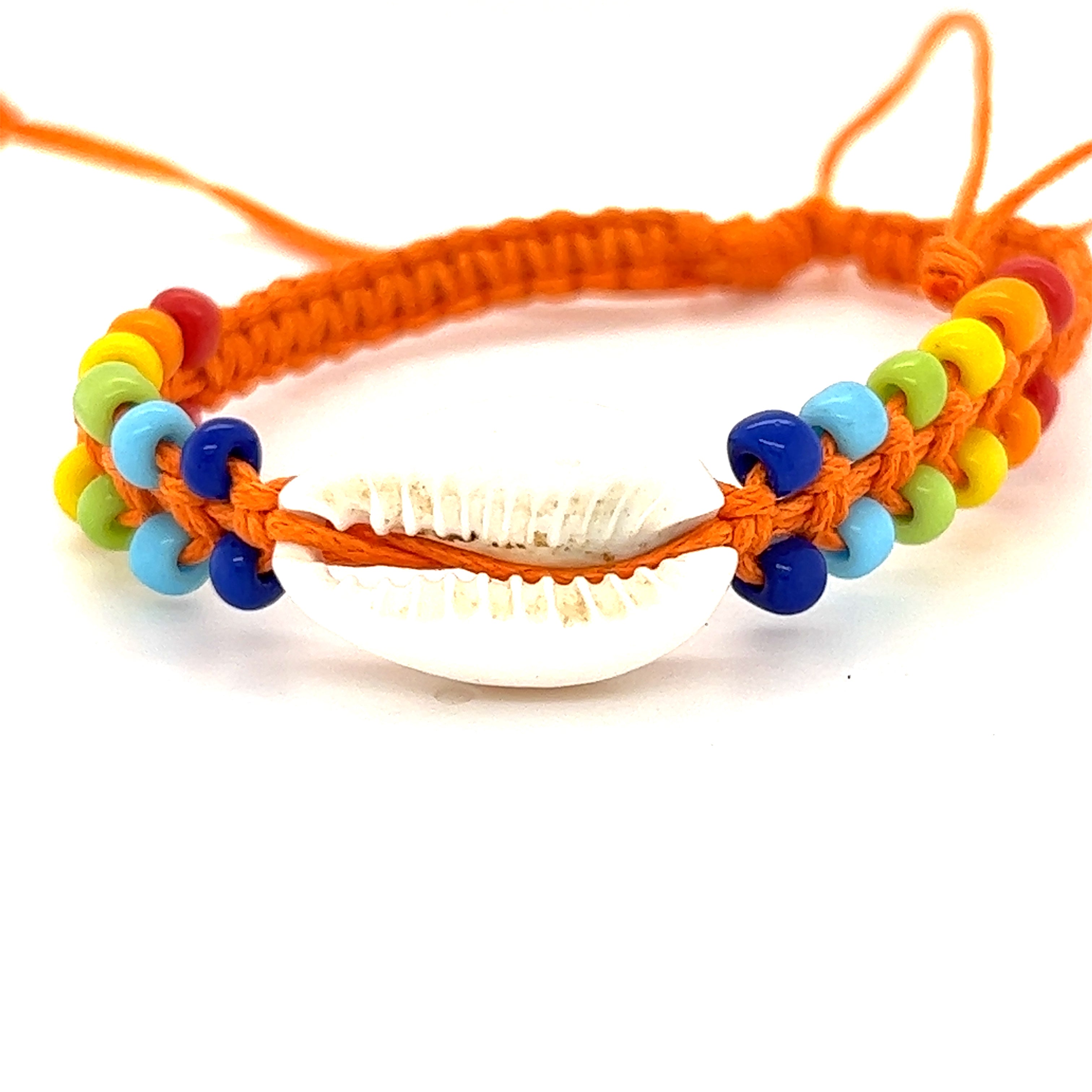 A vibrant Cowrie shell bracelet with a colorful adjustable band adorned with rainbow beads, the Super Silver Cowrie Shell Braided Bracelet.