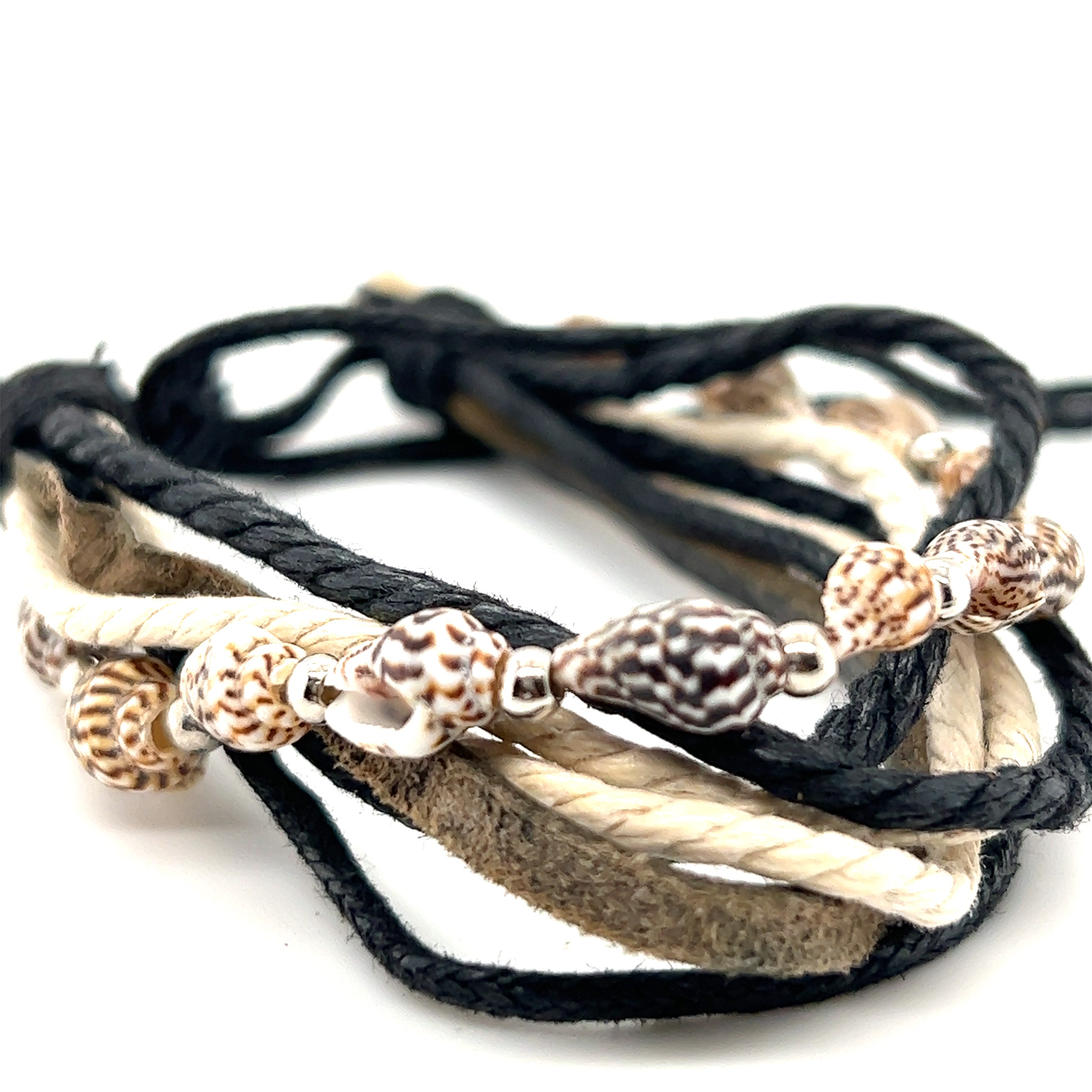 An earthy Rope Shell Bracelet with sea shells on an adjustable band. Perfect for everyday wear from Super Silver.
