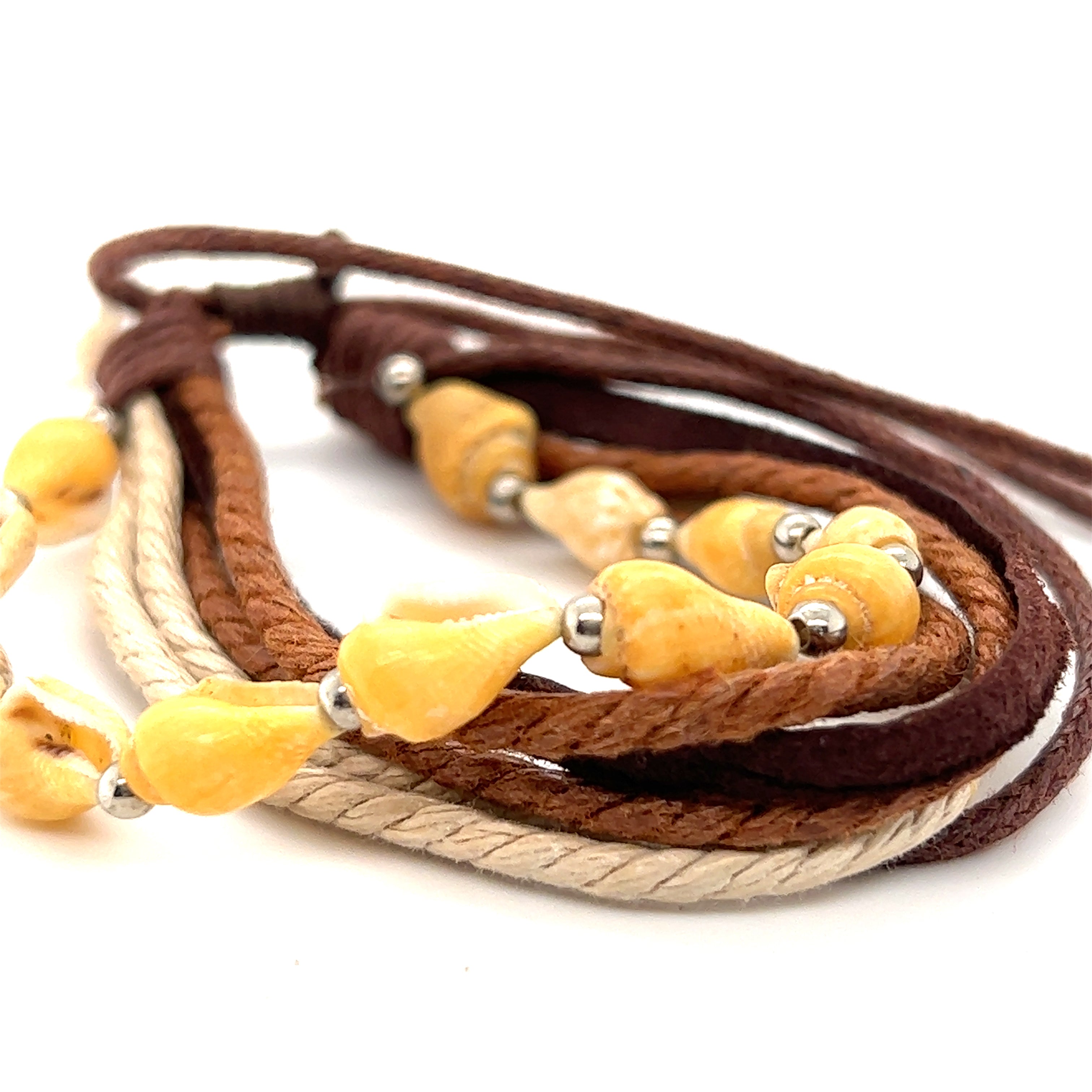 A Super Silver Rope Shell Bracelet with yellow and brown beads on a white background. The adjustable band makes it perfect for everyday wear.