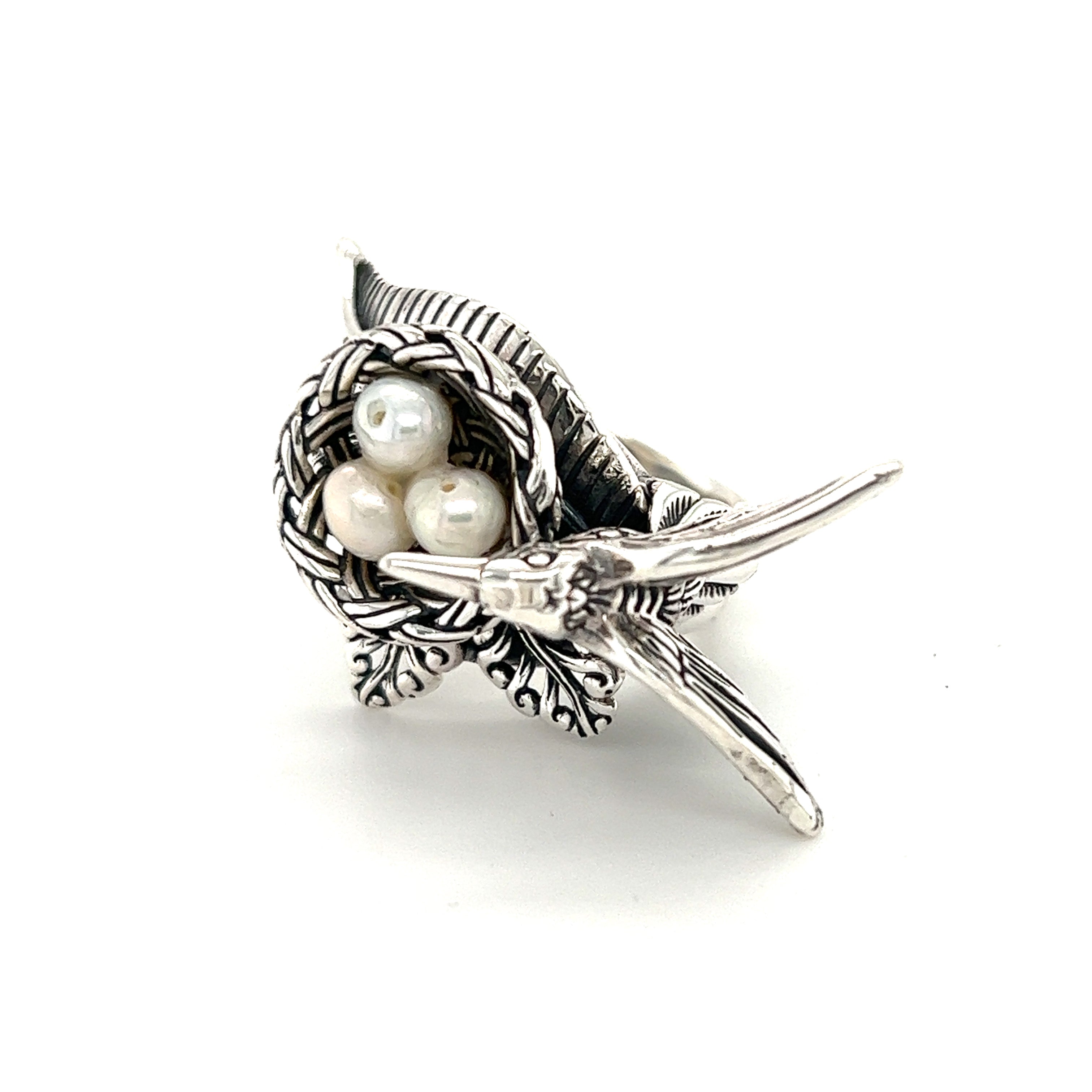 A Super Silver Hummingbird With Nest of Pearls Ring adorned with shimmering pearls.