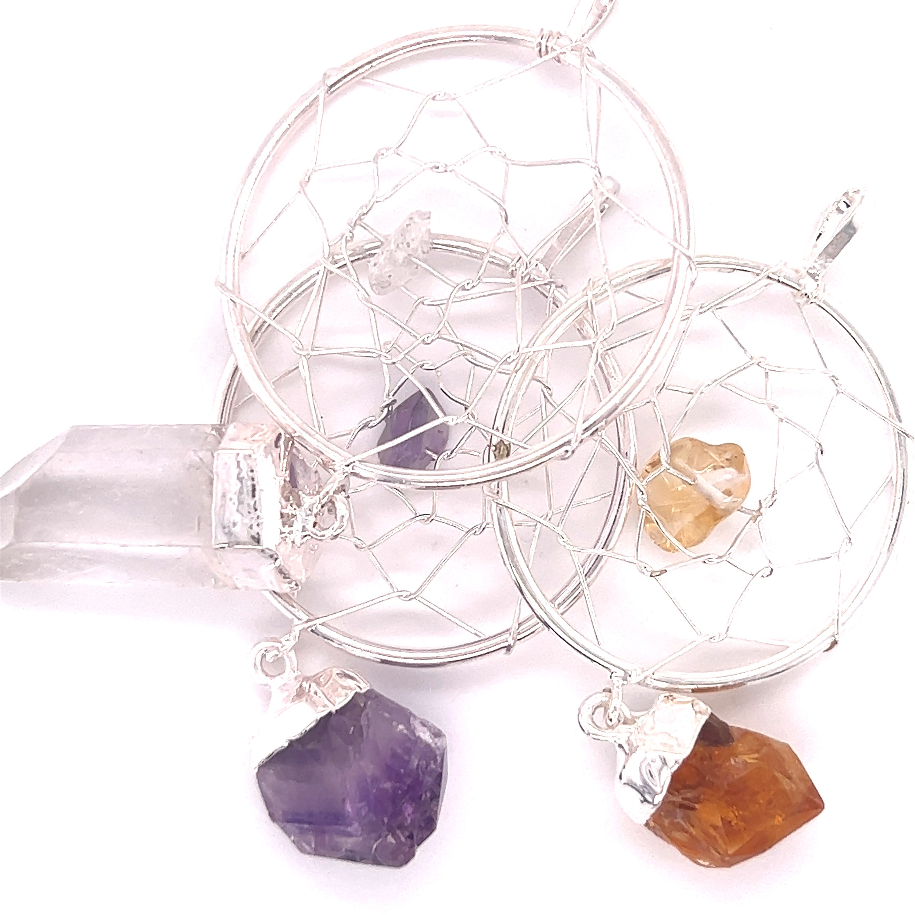 Three Super Silver Dreamcatcher Pendant with Gemstone Point necklaces with raw crystal droplets.