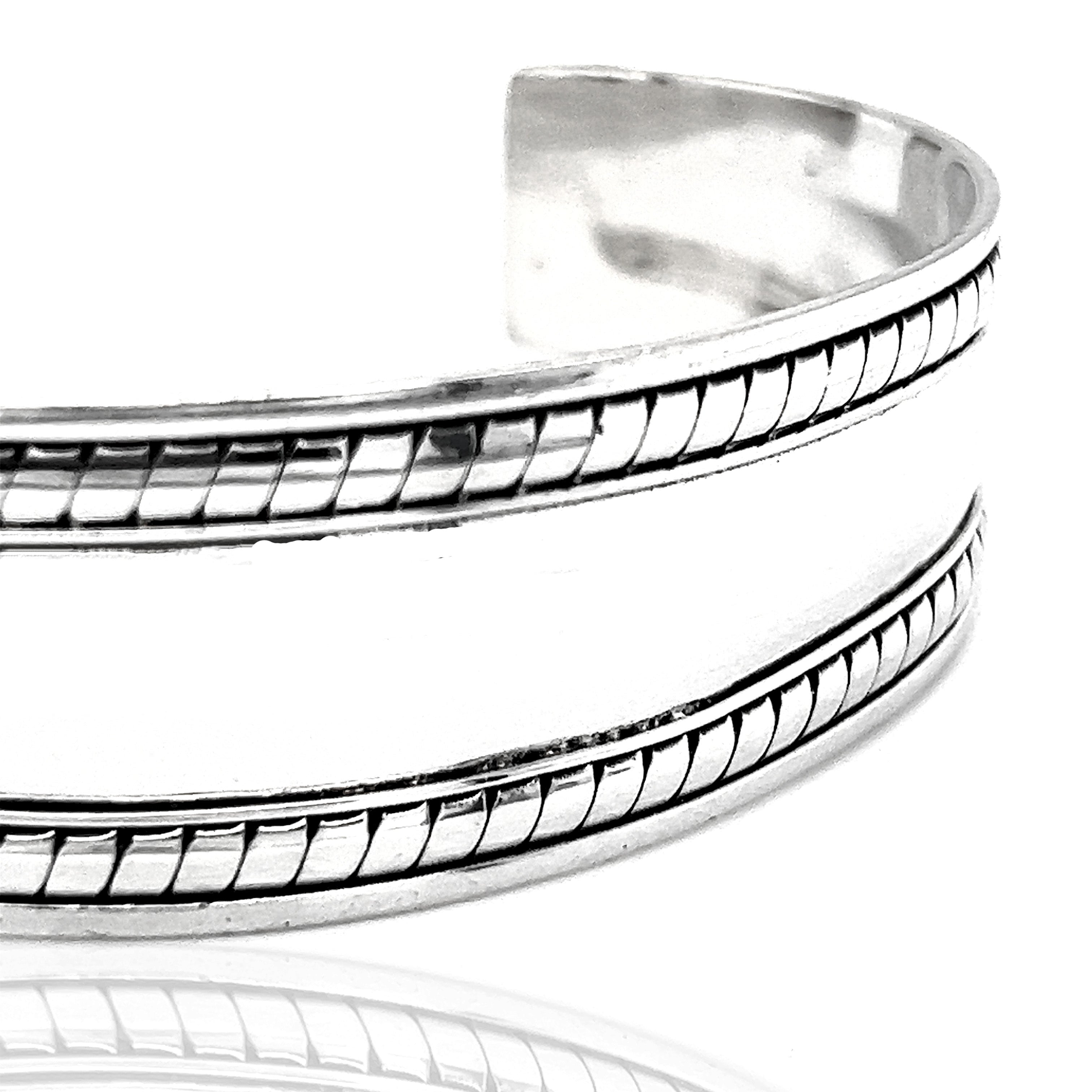 A Super Silver Domed Silver Cuff Bracelet with Rope Etching, perfect for everyday wear.