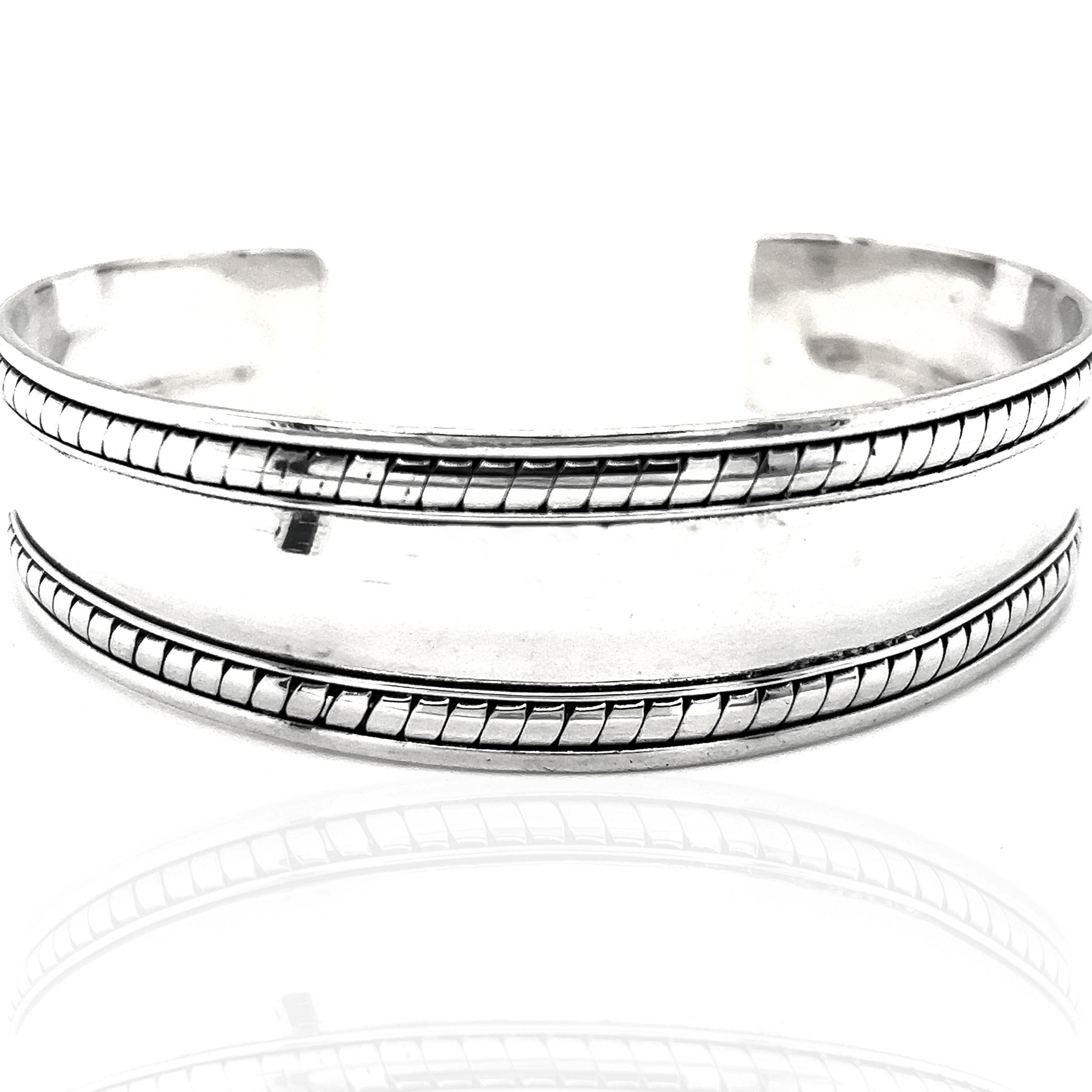A Super Silver Domed Silver Cuff Bracelet with Rope Etching, perfect for everyday wear.