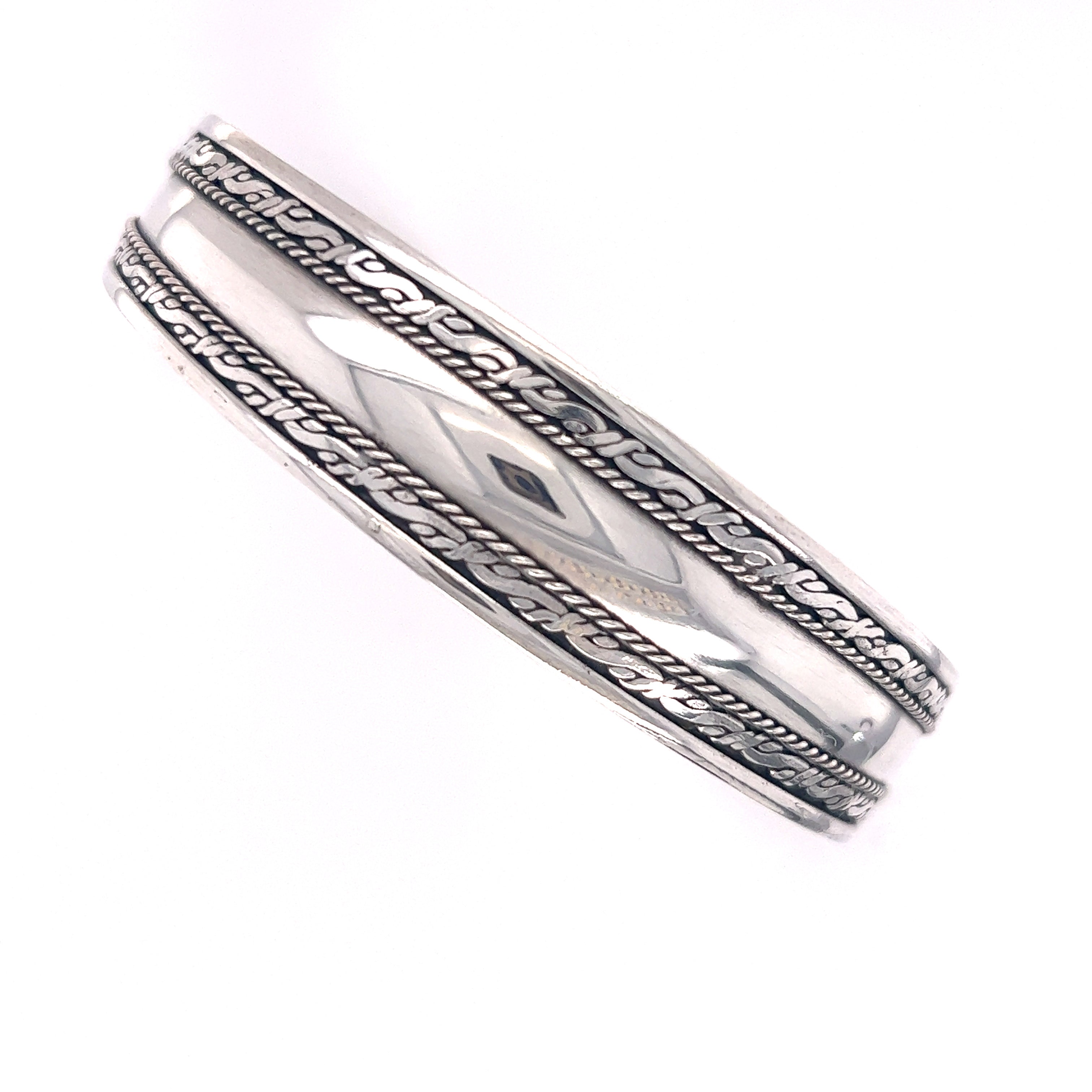A Super Silver Bali-inspired silver bangle with a braided design, perfect for stacking.