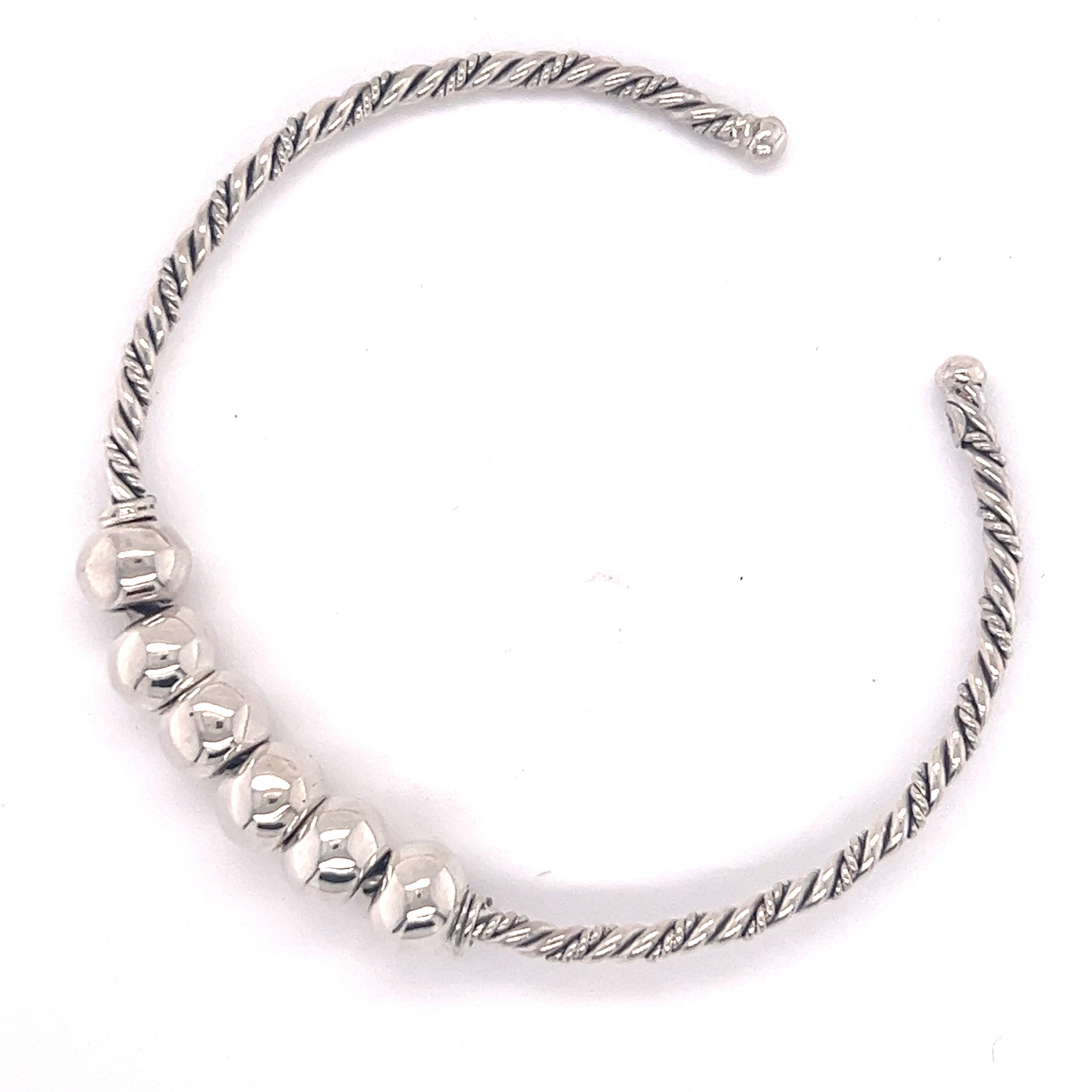 Handmade Twisted Cuff with Balls featuring five polished hexagonal beads.