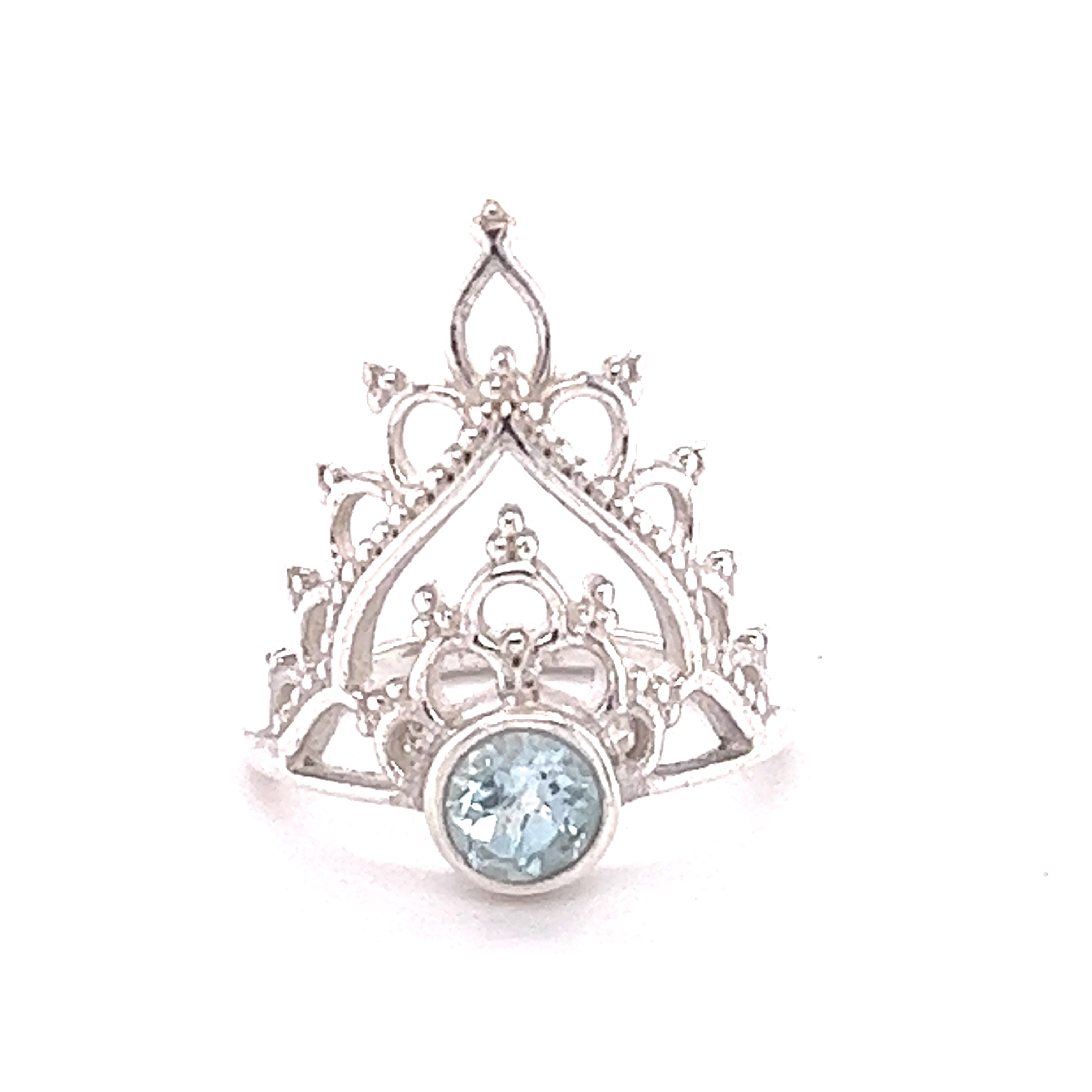 A Henna Crown Ring with Natural Gemstones featuring a stunning blue topaz cabochon.