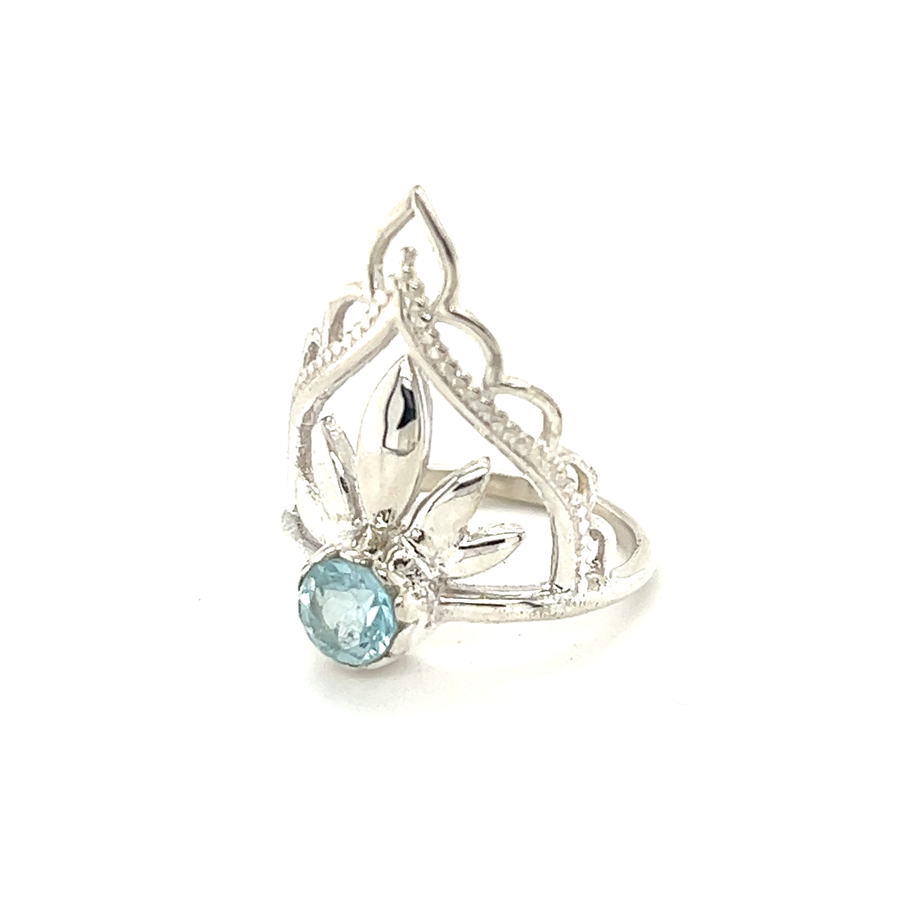 A Mandala Flower Crown Ring with Natural Gemstones inspired by boho style, featuring a sterling silver band and a mesmerizing blue topaz cabochon stone.