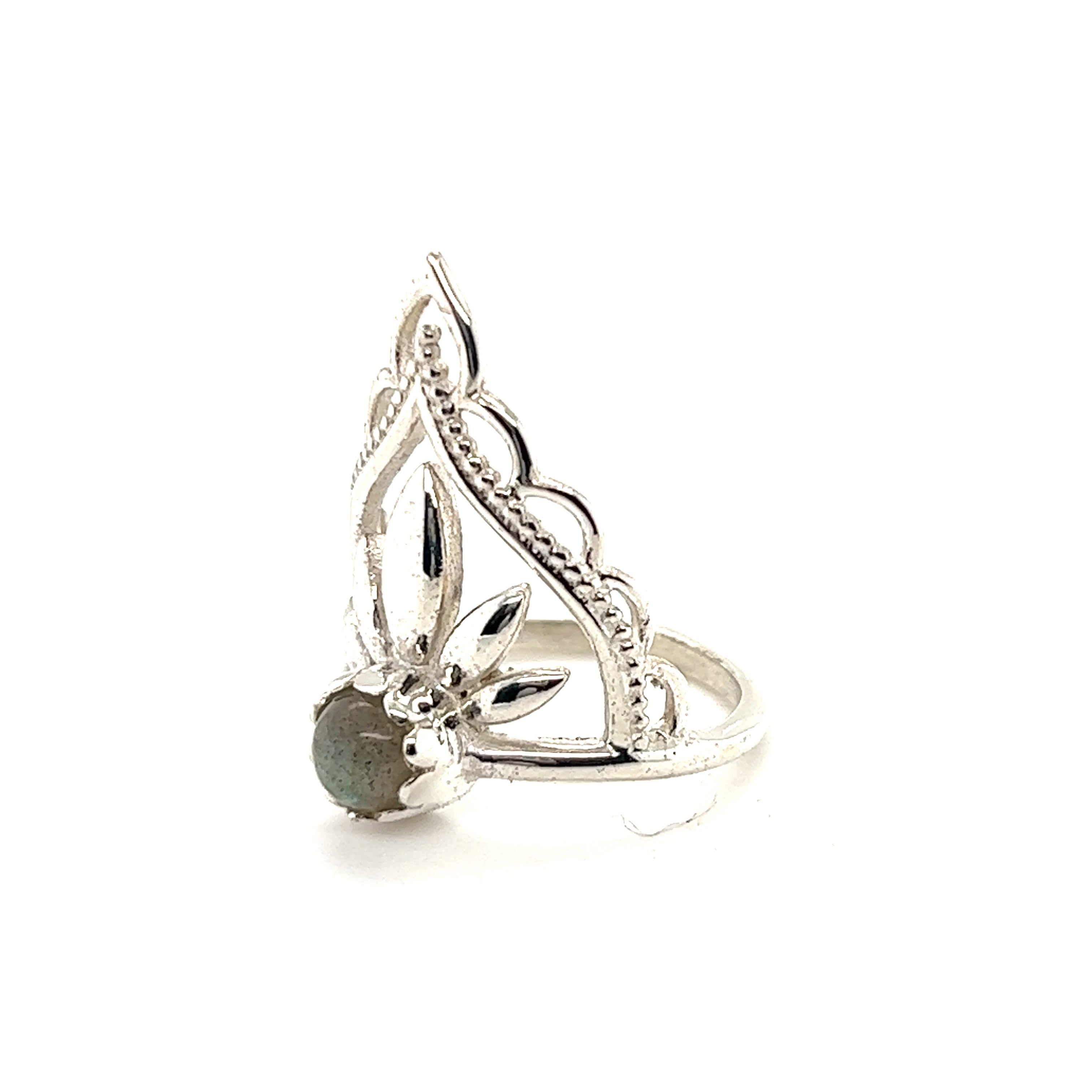 A Mandala Flower Crown Ring with Natural Gemstones from Super Silver, adorned with a mesmerizing labradorite stone, boasting the natural beauty of gemstones.