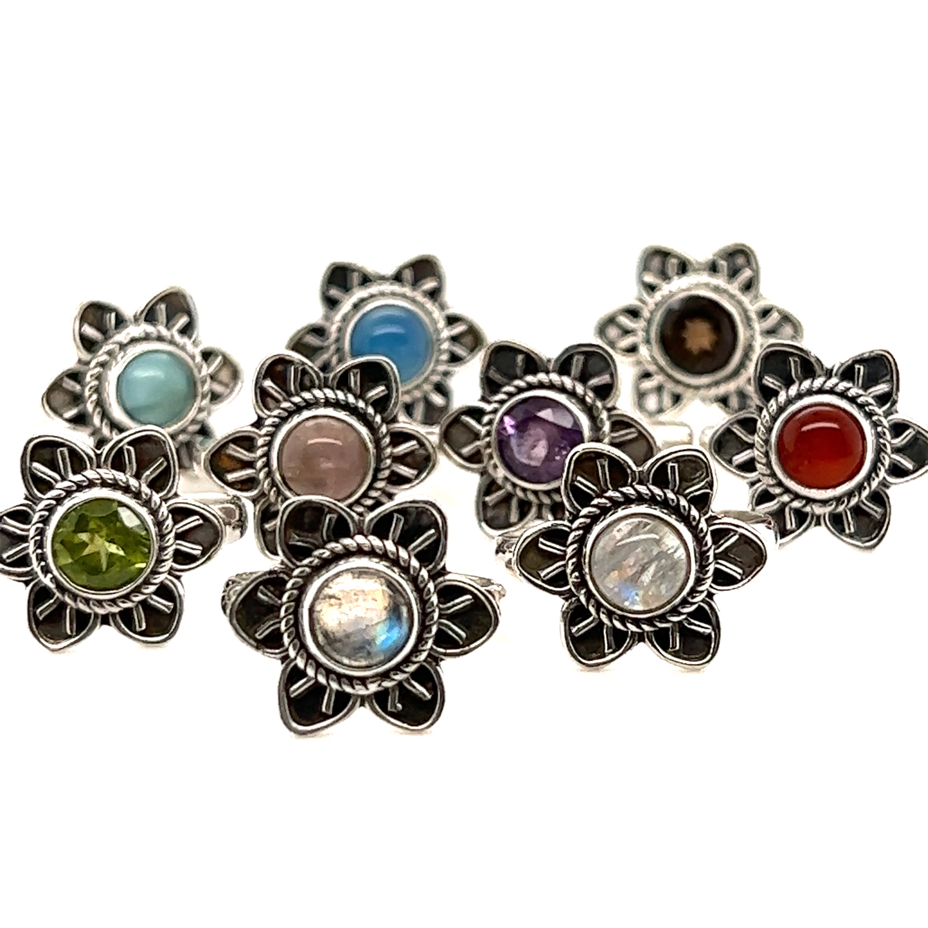 A set of Enchanting Flower Ring with Natural Gemstones in a variety of colors.