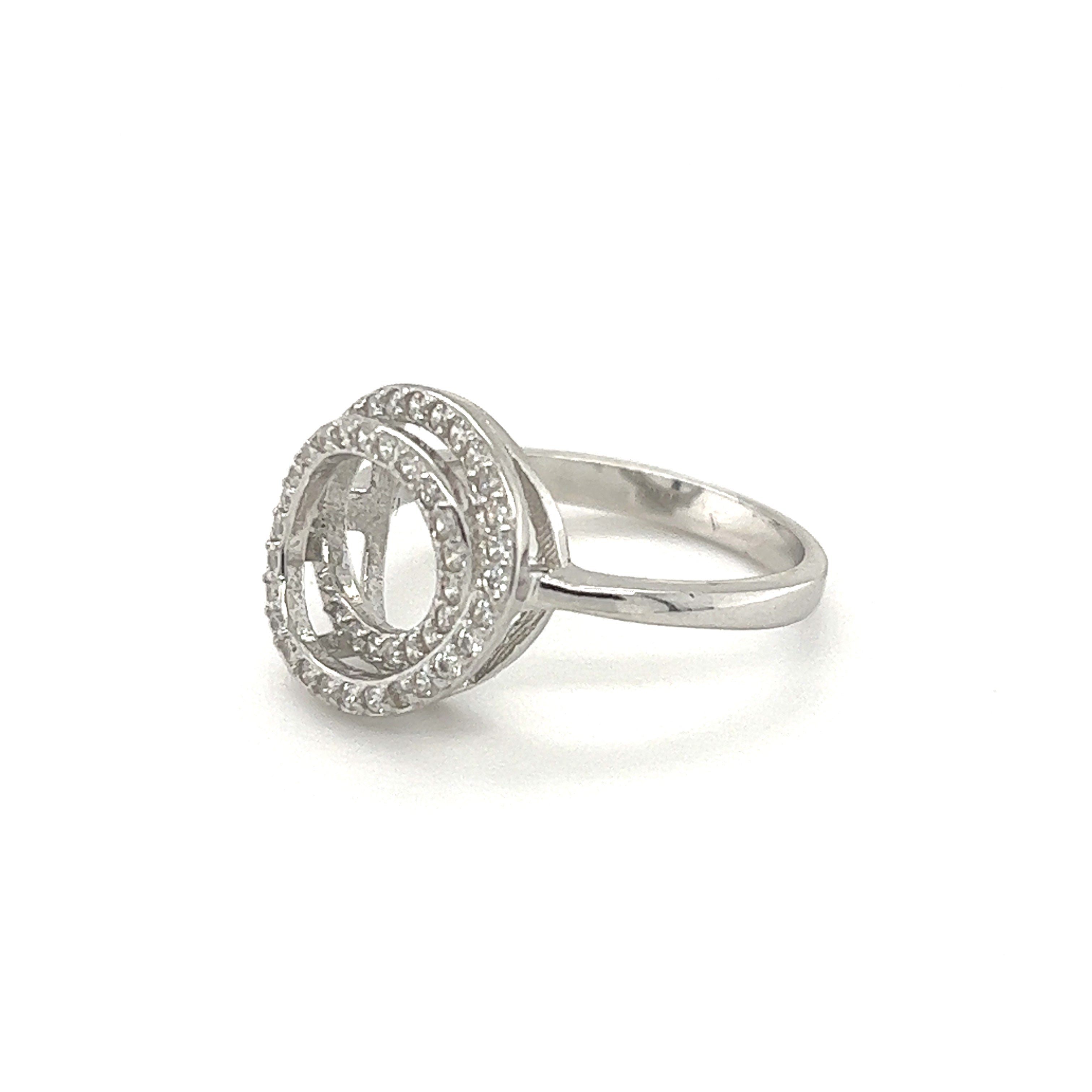 A sterling silver engagement ring with the Cubic Zirconia Twisted Circle Ring in the center.