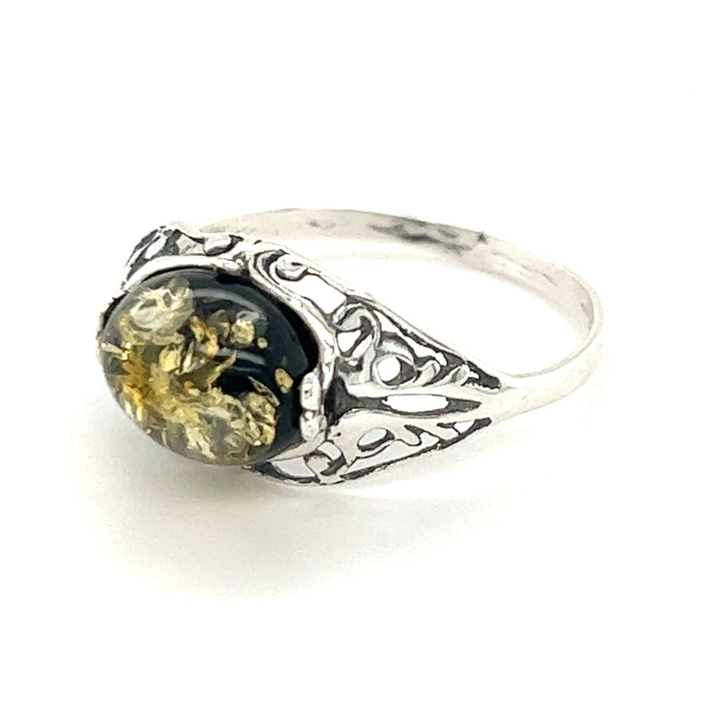 A Glowing Green Baltic Amber Ring with a black and Baltic amber stone by Super Silver.