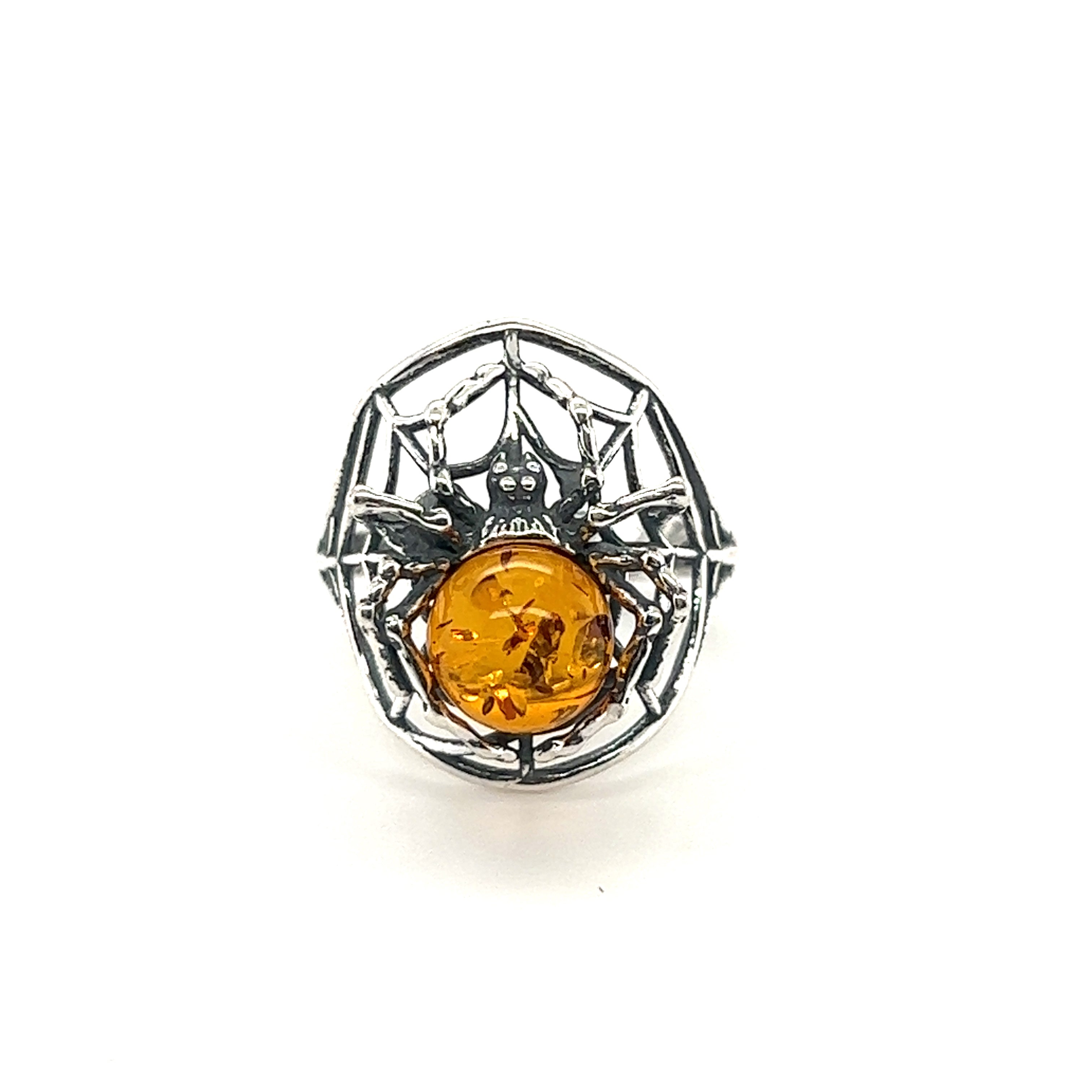 A Entrancing Adjustable Baltic Amber Spider Ring featuring a spider design with a large Baltic amber stone set in the center, on a white background.
