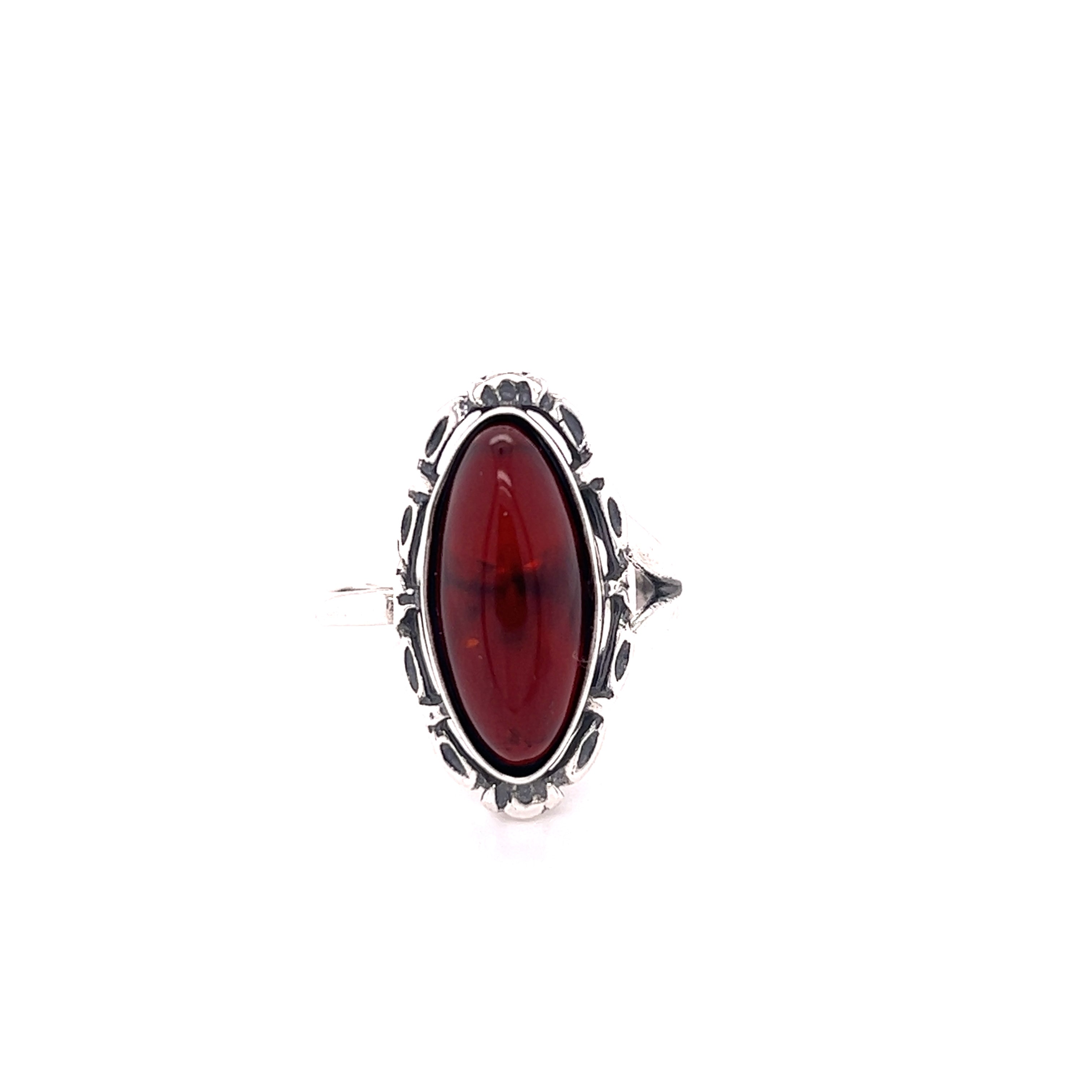 Enchanting Adjustable Baltic Cherry Amber ring with an oval red gemstone surrounded by black accents on a white background.