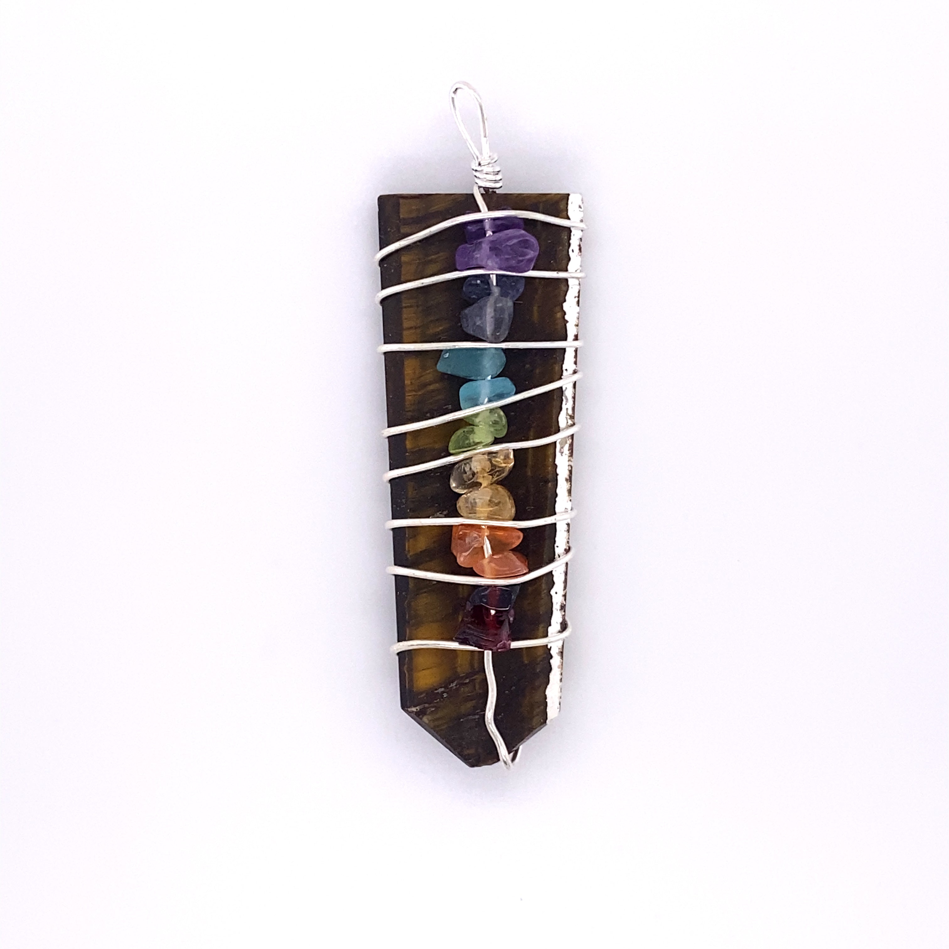 A Stone Slab Wire-Wrapped Chakra Pendant adorned with colorful gemstones.