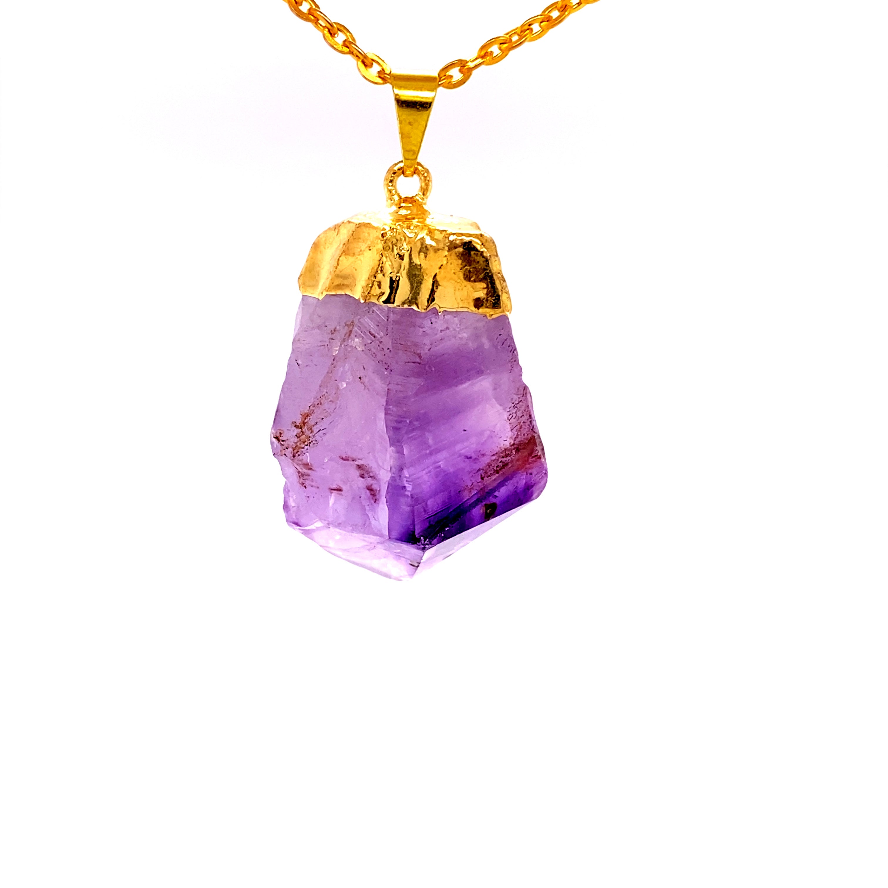A Super Silver Raw Crystal Pendant With Gold Cap on a gold chain.