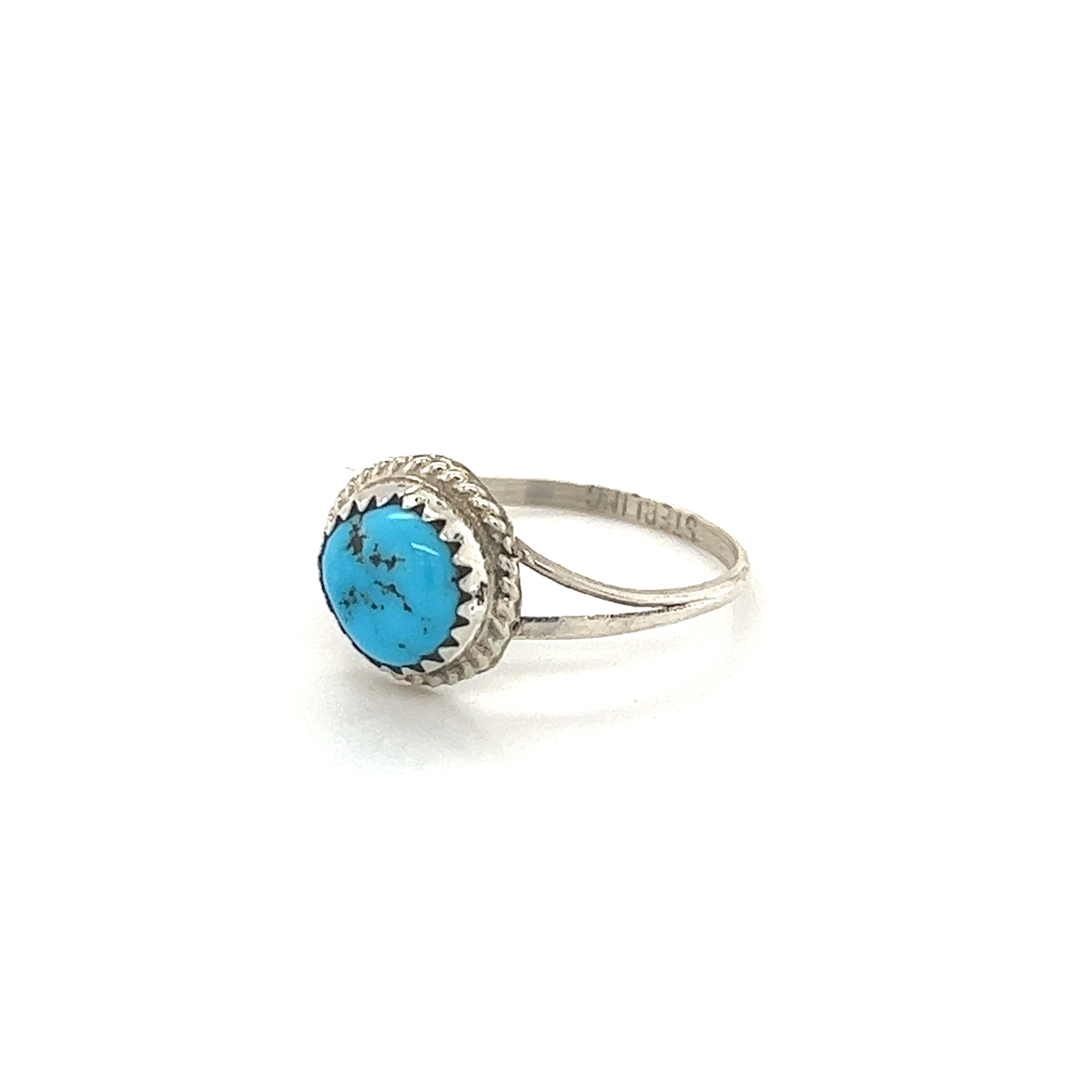 A cultural Classic Round Handmade Turquoise Ring with a stone.