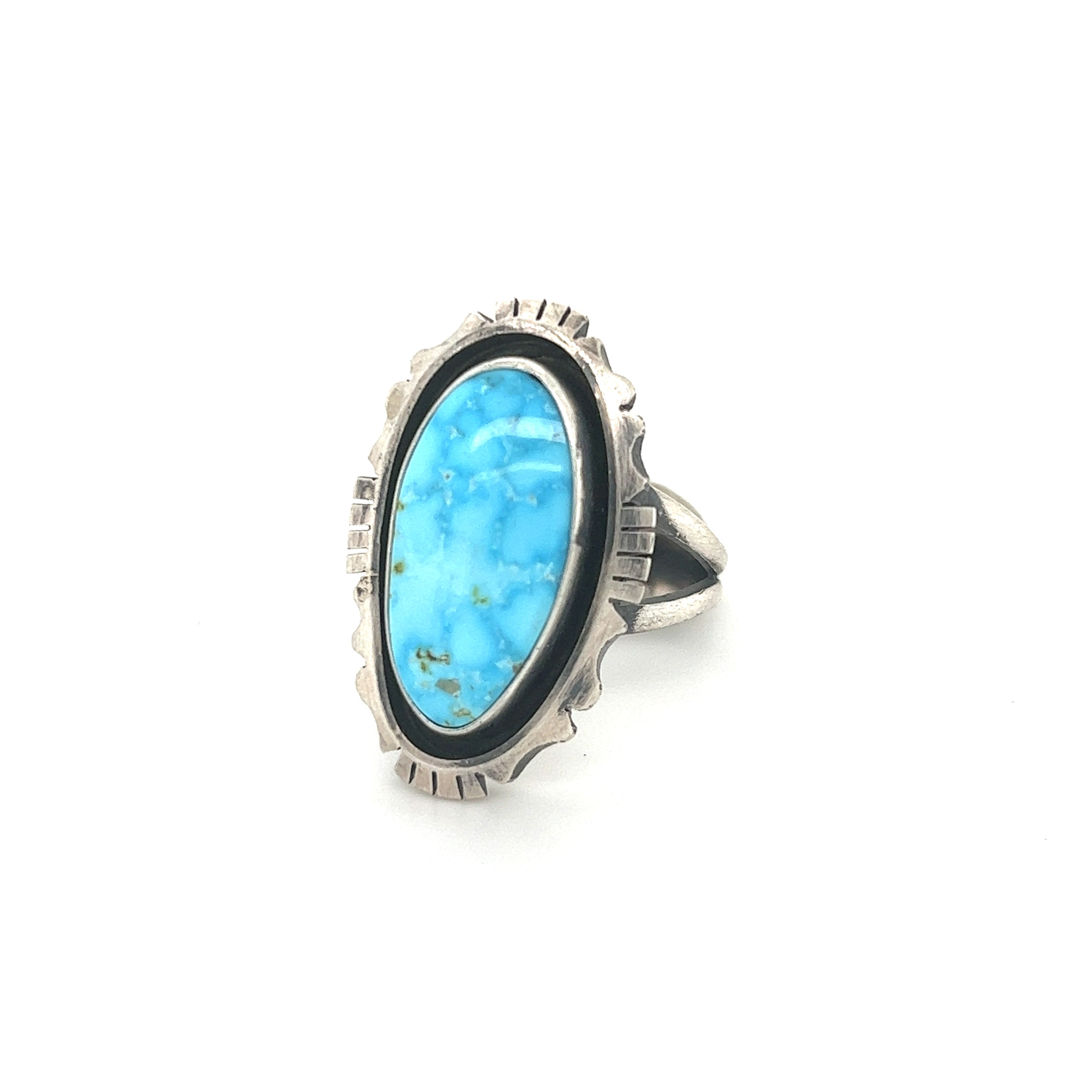 A Stunning Native American Turquoise Ring on a white background.