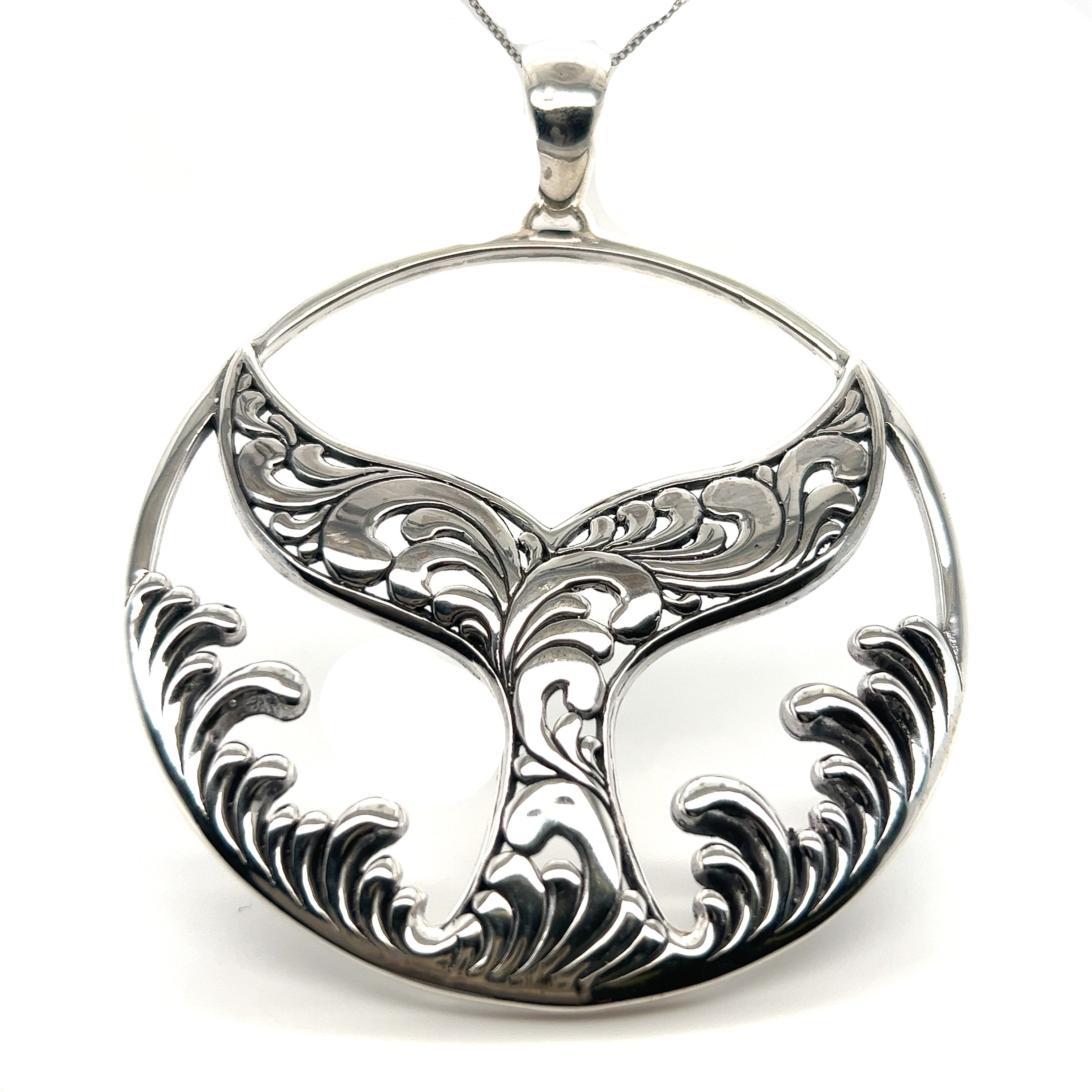 A Extravagant Whale Tail Pendant with a sterling silver pendant, perfect for ocean lovers and those with a connection to Santa Cruz, by Super Silver.