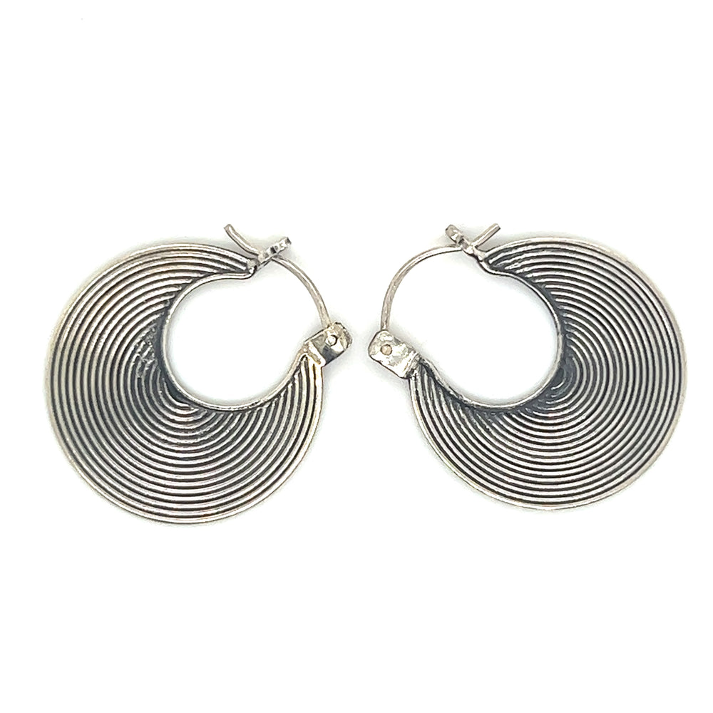 
                  
                    A pair of Textured Flat Bali Hoops by Super Silver on a white background.
                  
                