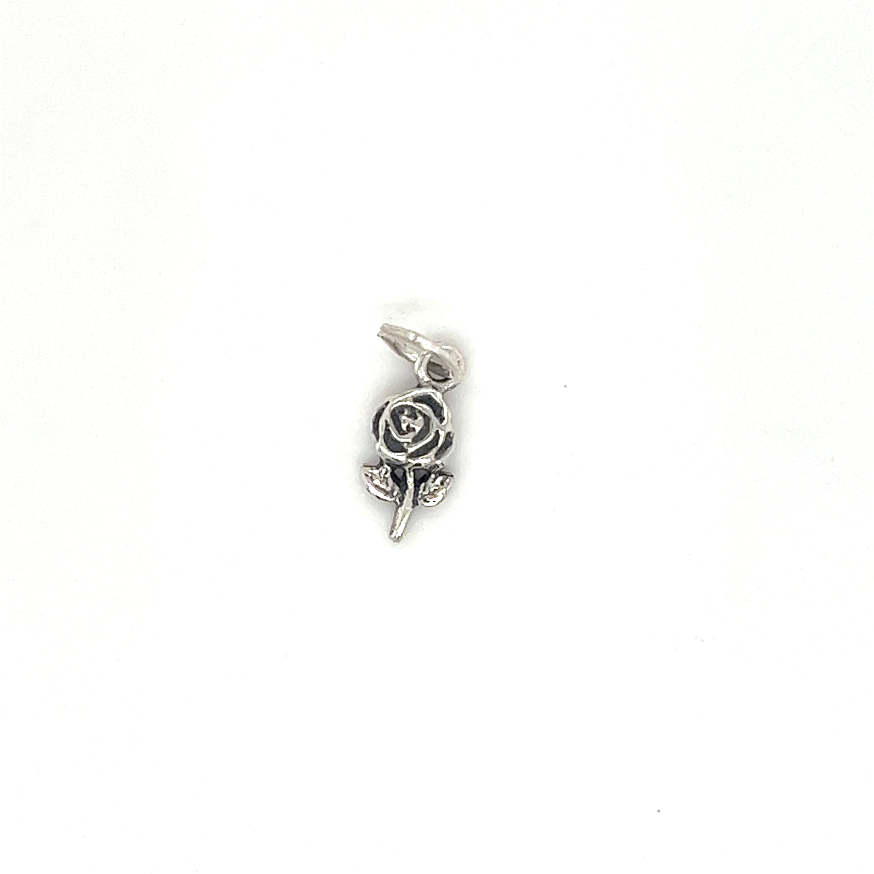 A small Super Silver Tiny Single Rose Charm on a white background, perfect for minimalist plant lovers.