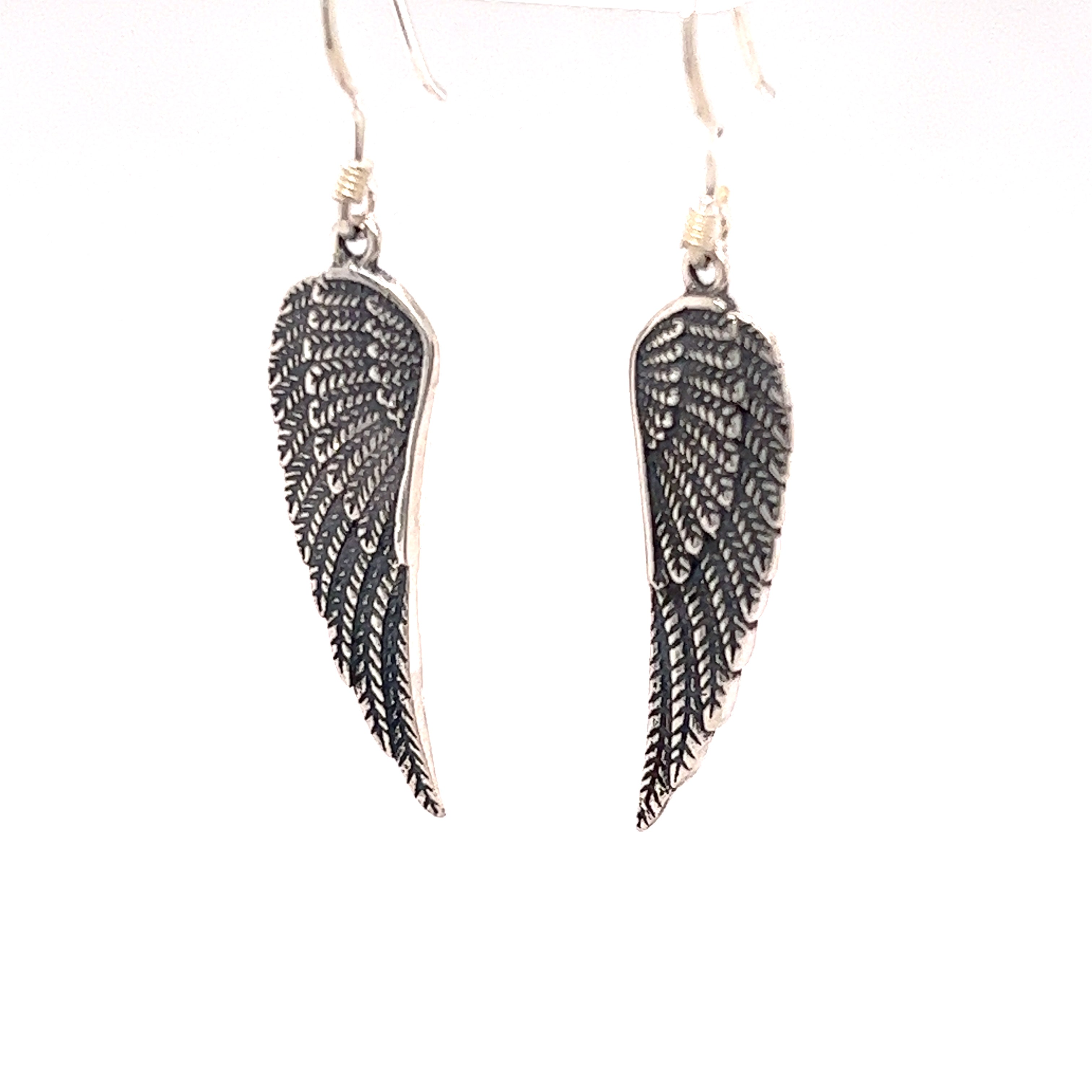A pair of Super Silver Charming Wing Earrings on a white background.
