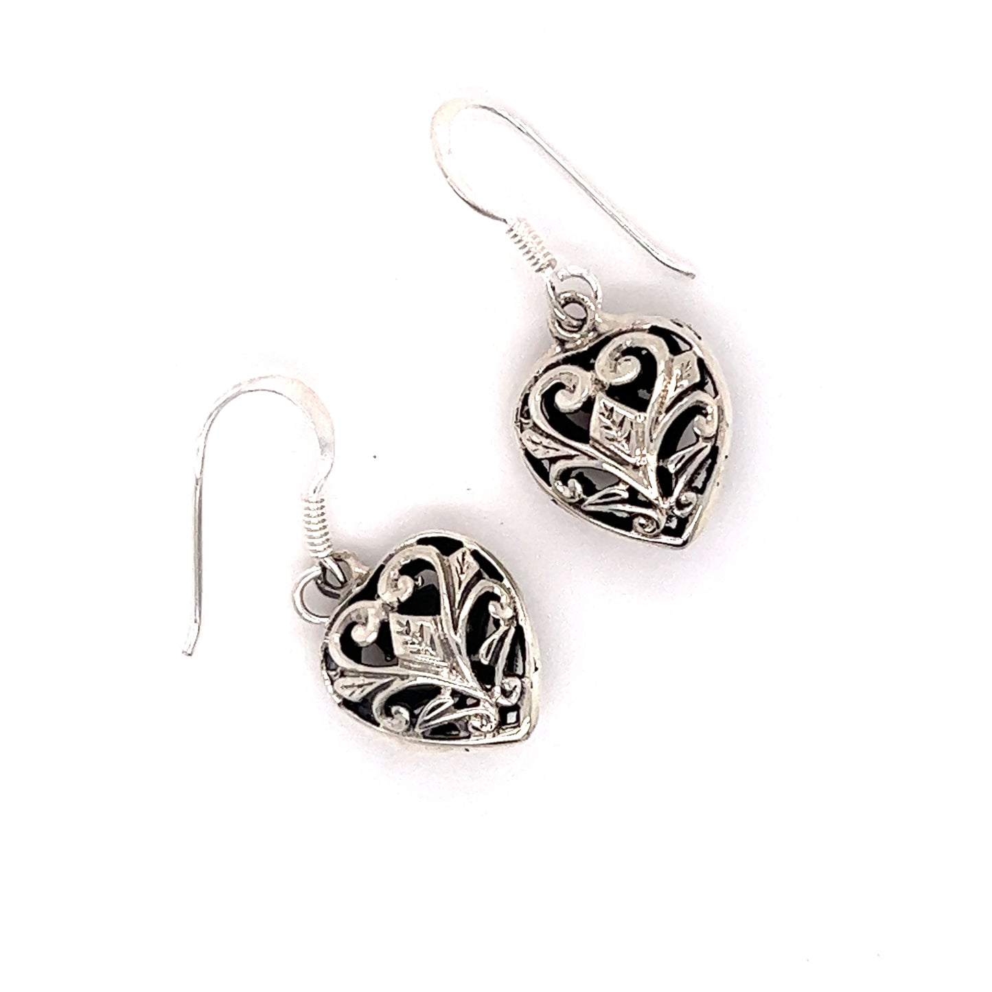 A pair of Timeless Filigree Heart Earrings by Super Silver, with a Victorian feel, showcased on a white background.