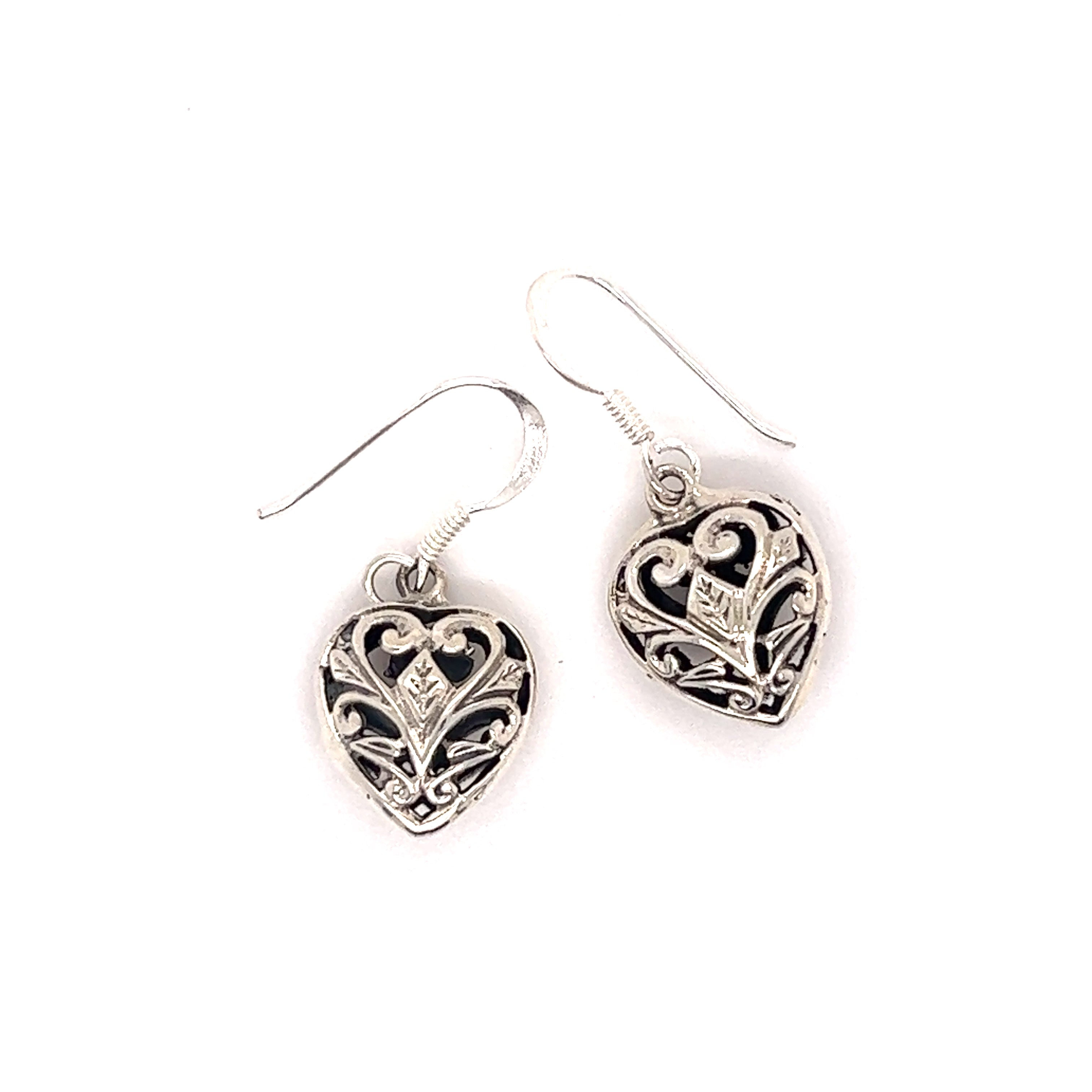A pair of Timeless Filigree Heart Earrings by Super Silver with a Victorian feel and an ornate heart design.