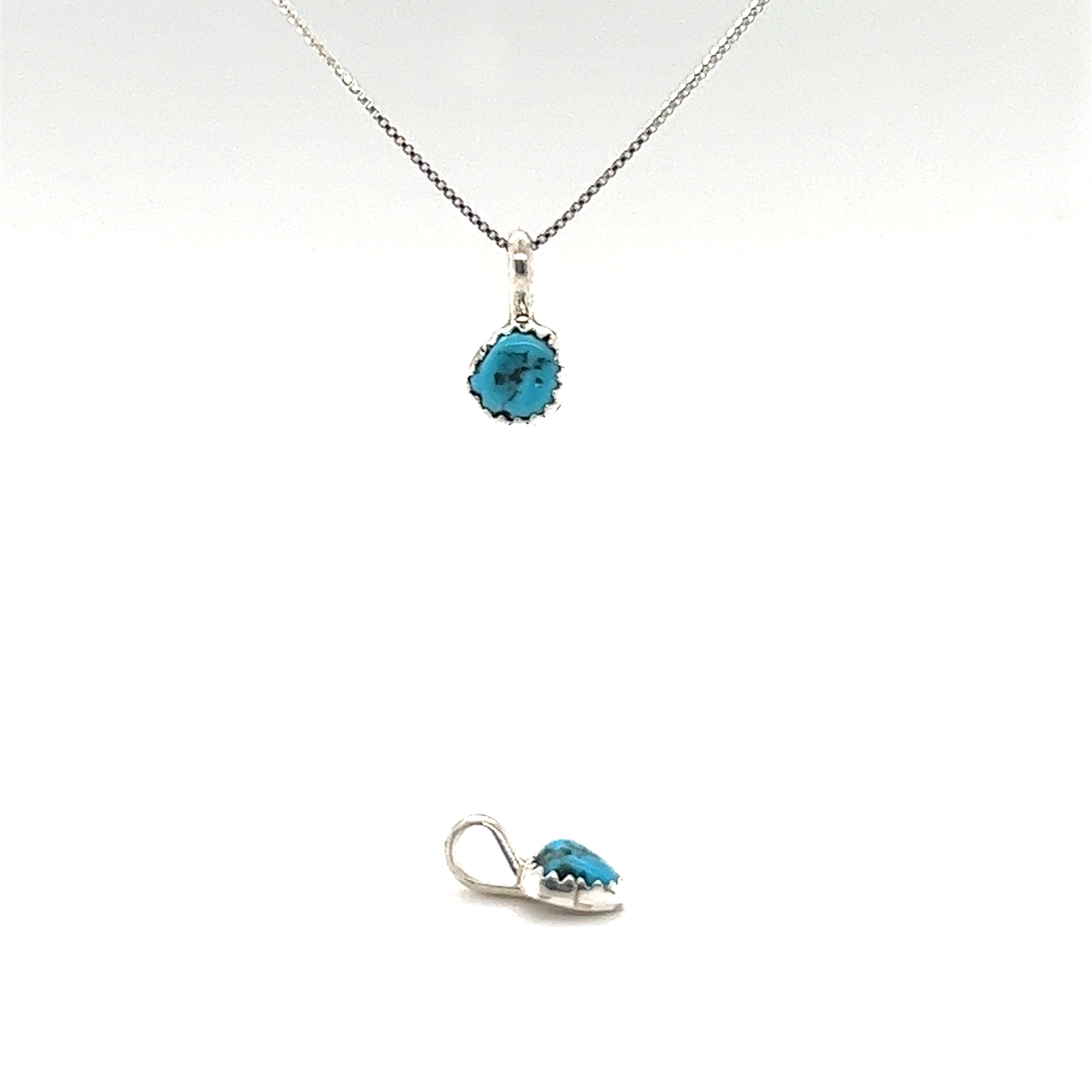 This Super Silver jewelry set consists of a necklace and earring pair, featuring the Teeny Tiny Native American Turquoise Nugget Pendant encased in a silver claw tooth frame.
