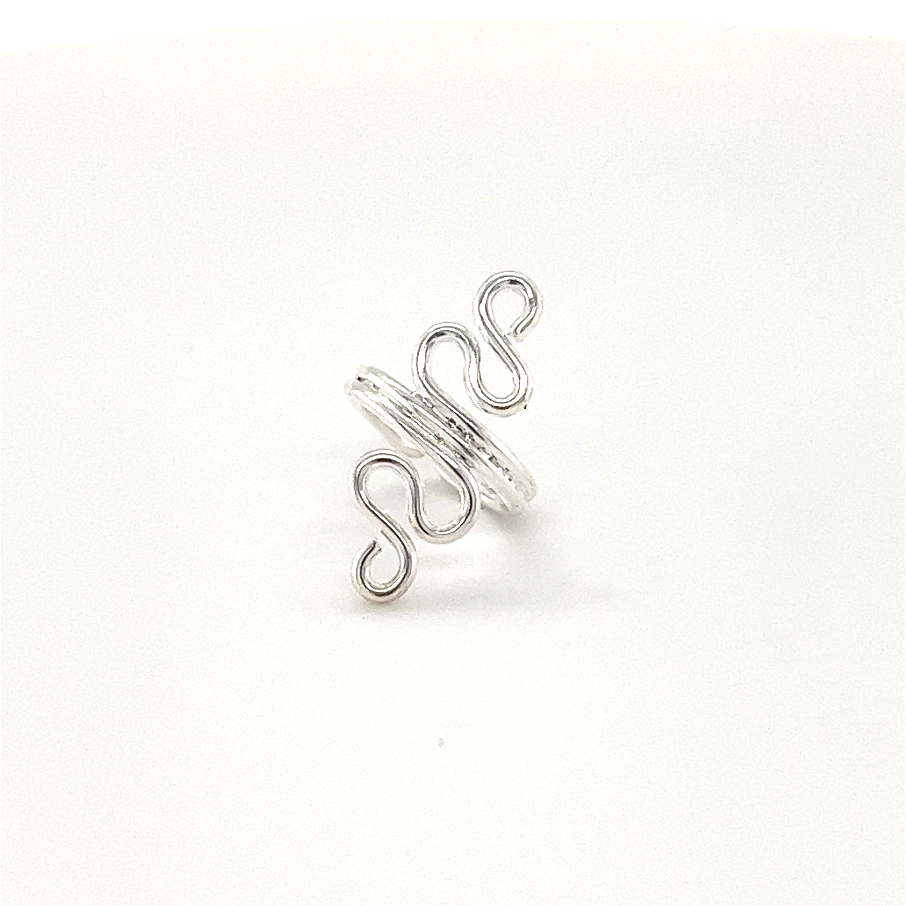 This authentic Super Silver ear cuff showcases a stunning spiral design, exuding trendy bohemian vibes.