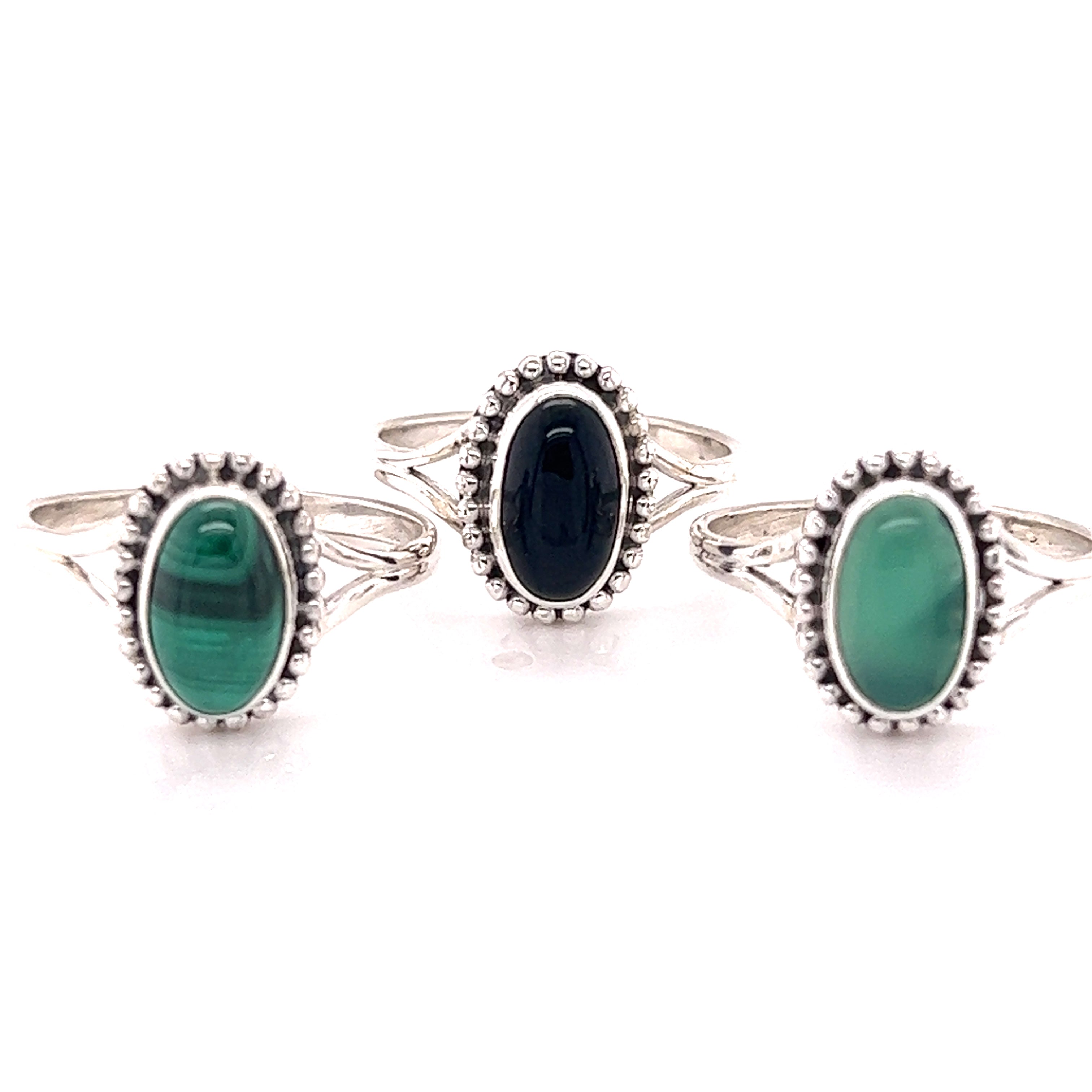 Three Stylish Oval Gemstone Rings with Ball Border in green and black hues from Santa Cruz.