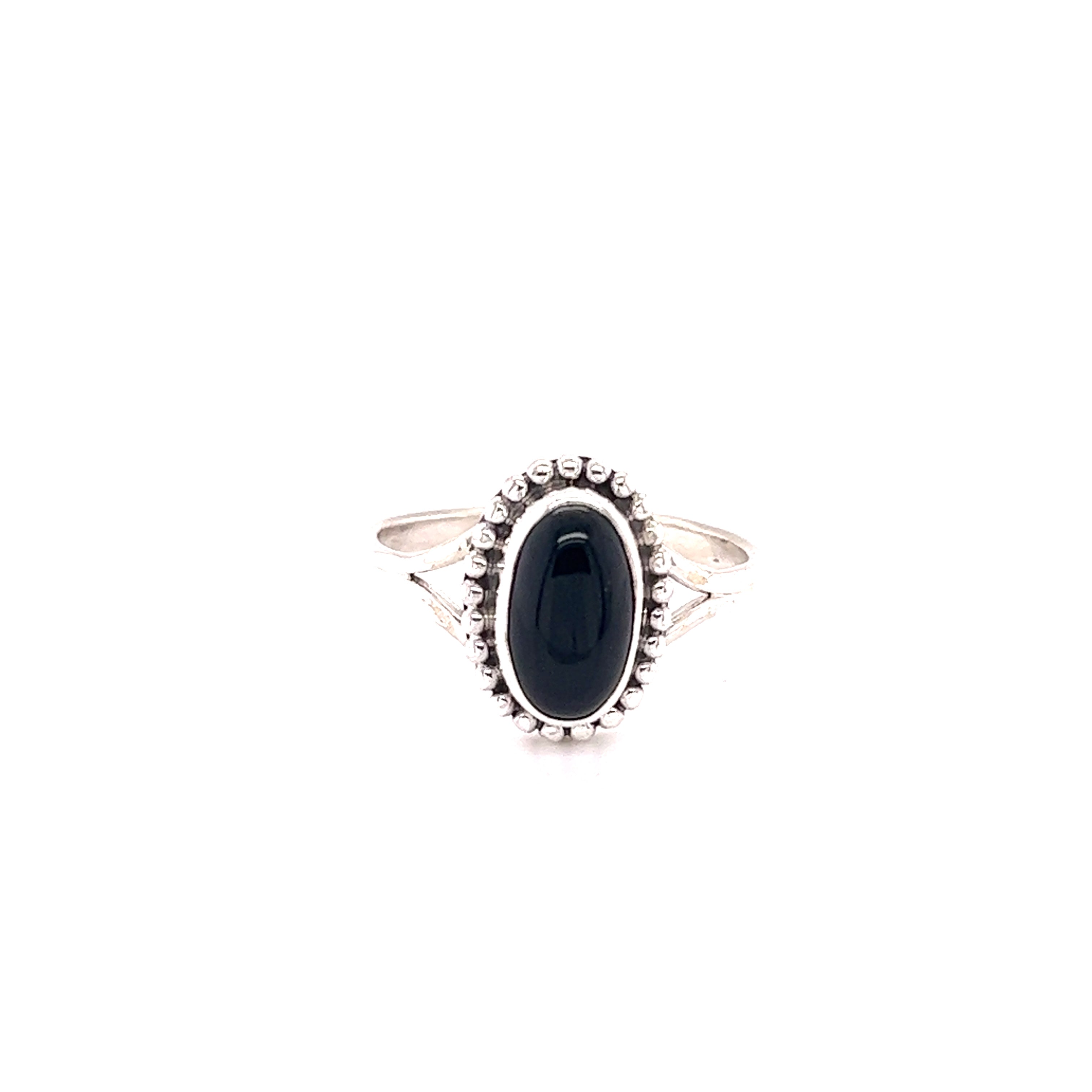 A stylish oval gemstone ring with a ball border on a white background.