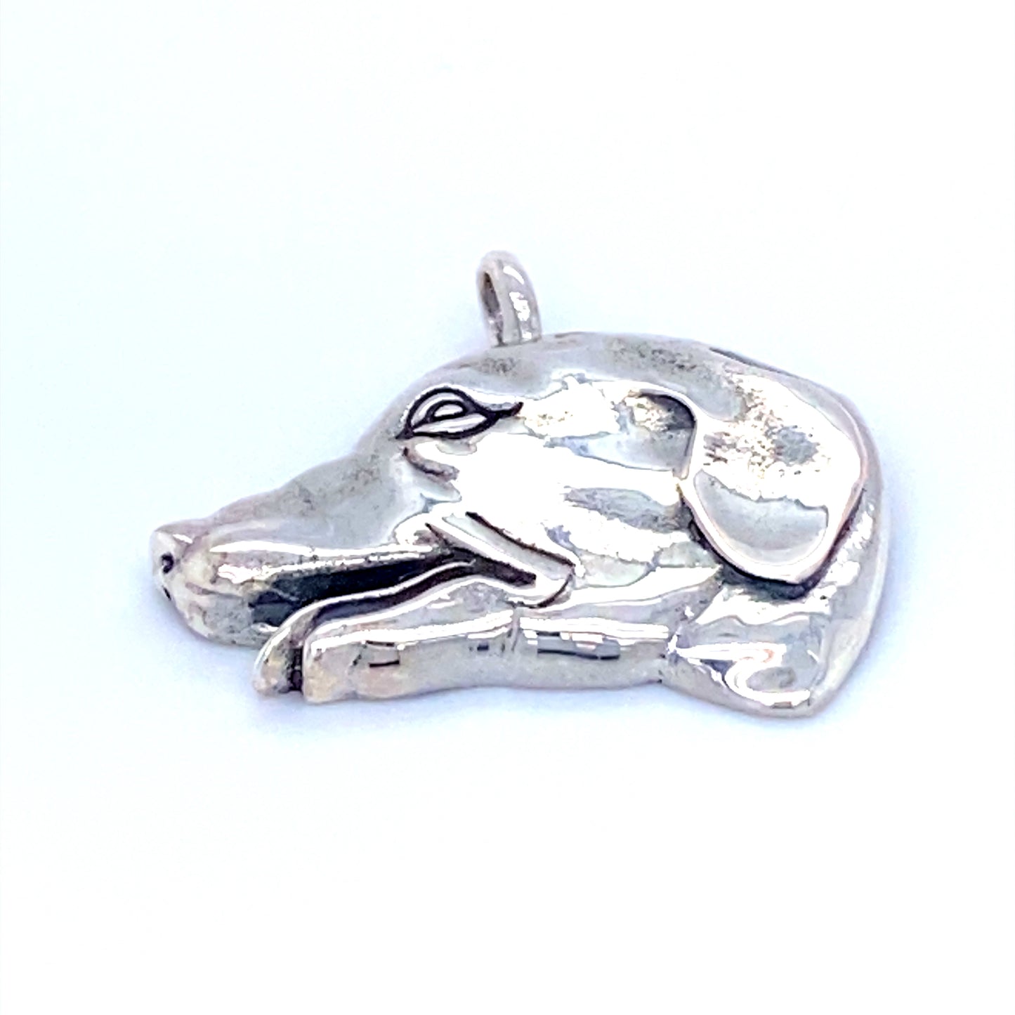 A Super Silver Dog Head Pendant on a white background.