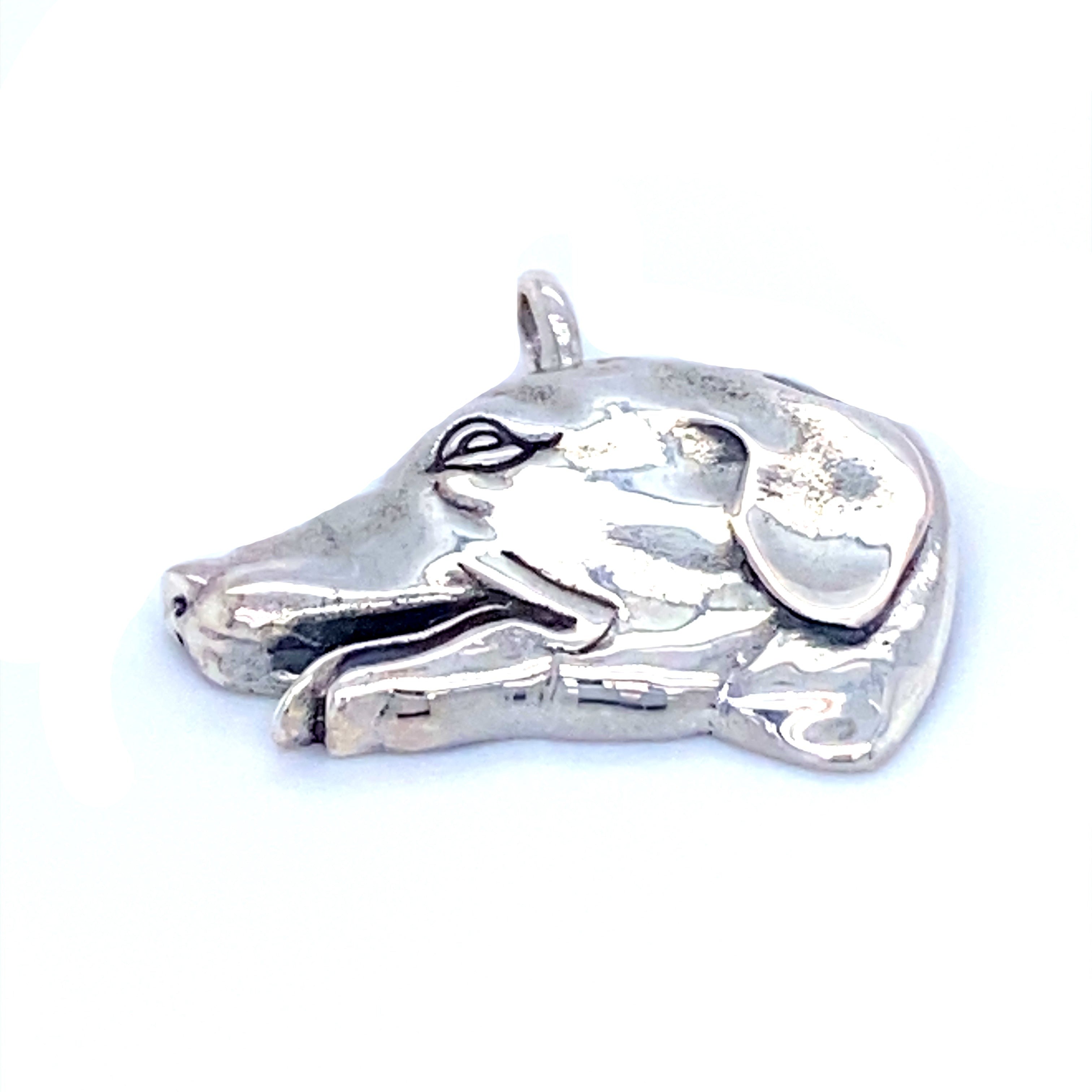 A Super Silver Dog Head Pendant on a white background.