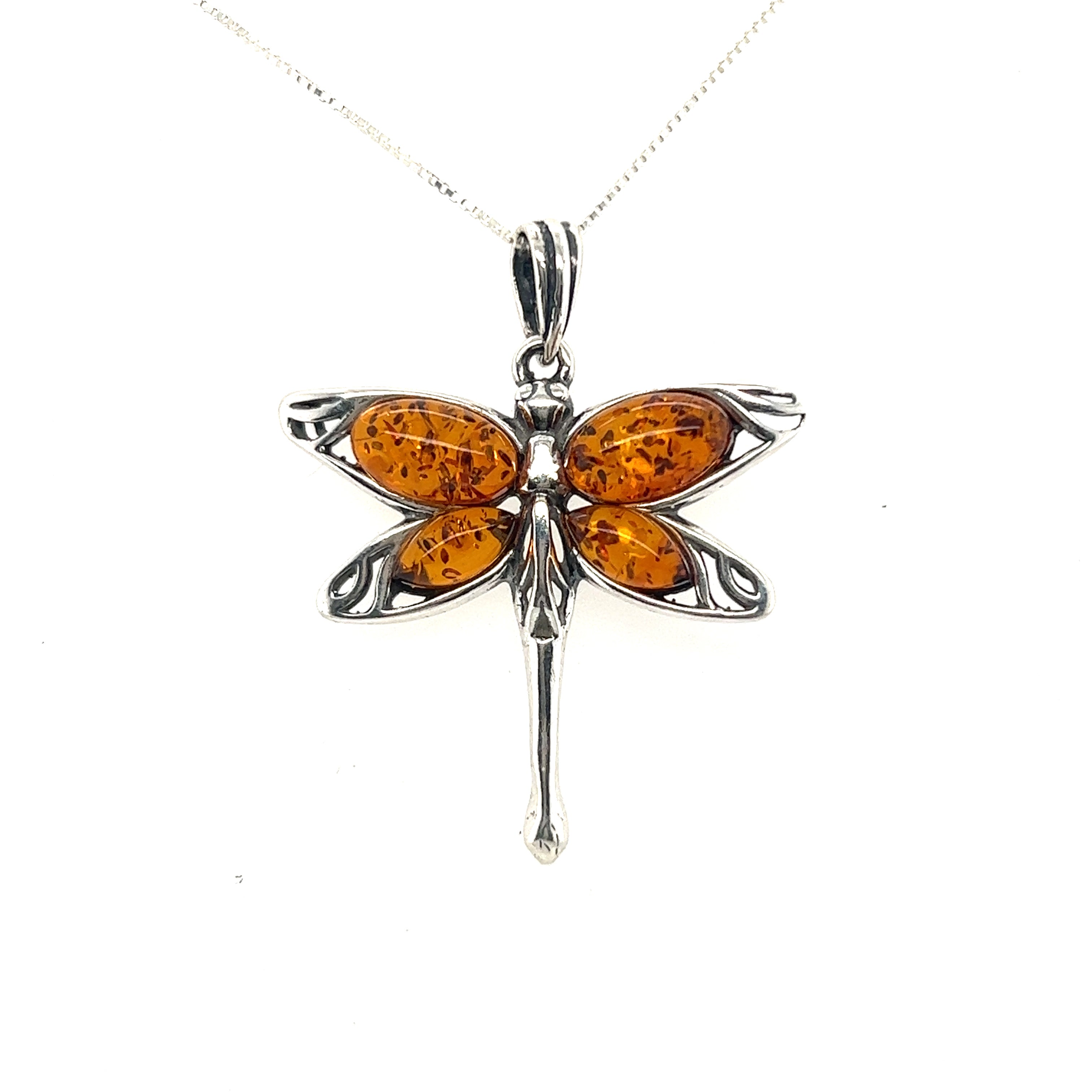 Super Silver Baltic Amber Dragonfly Pendant made from a powerful healing stone.