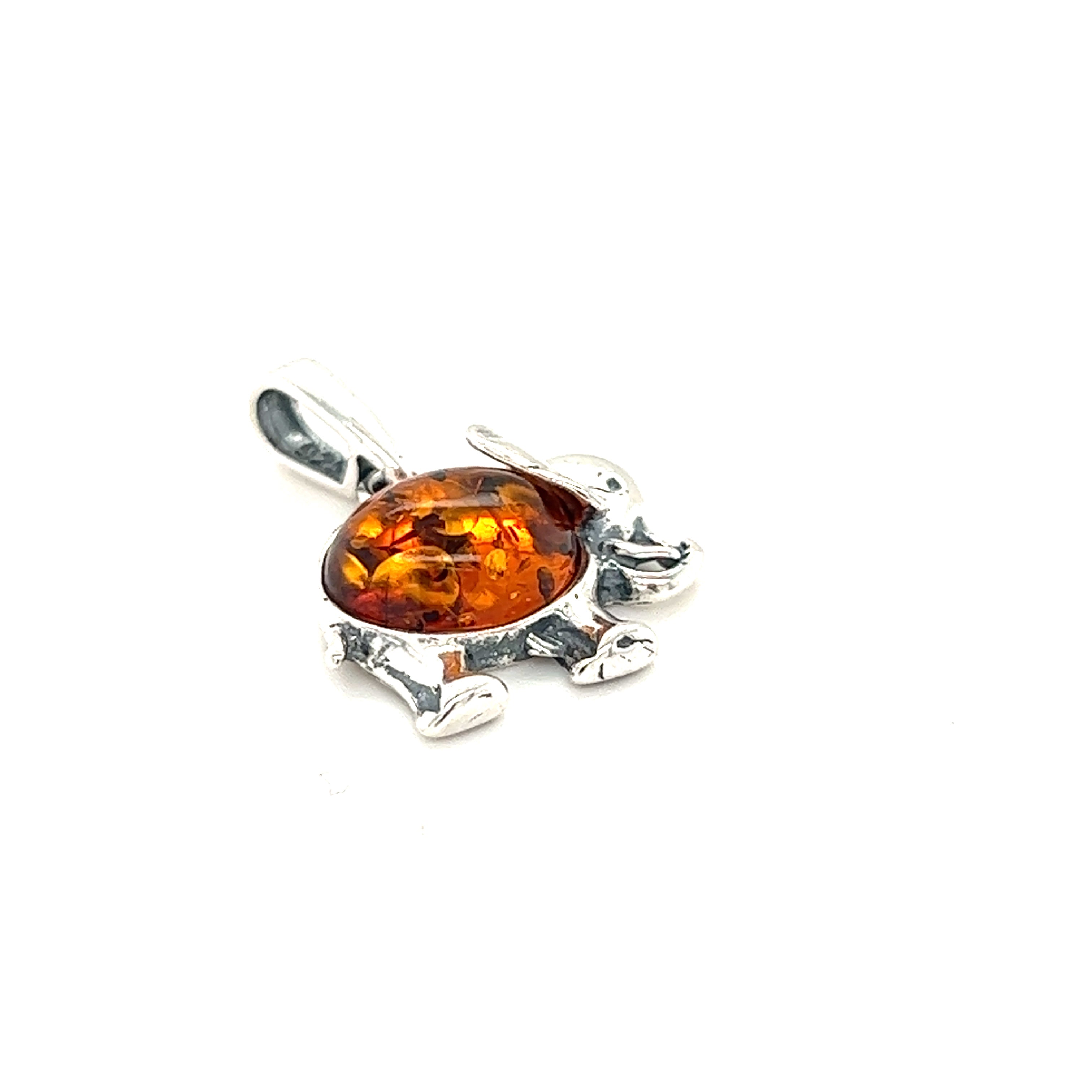 A Dainty Amber Elephant Pendant by Super Silver with an orange Baltic amber stone.