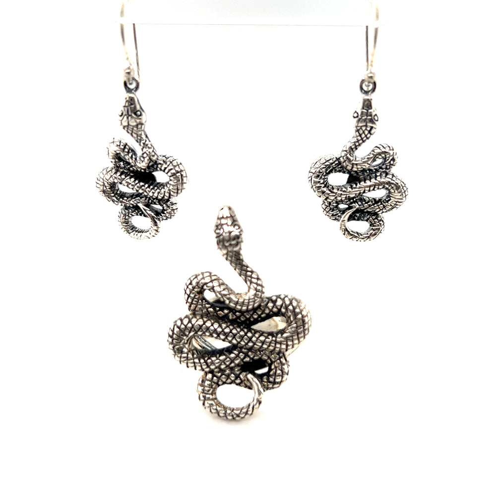 
                  
                    A designer silver snake ring and earring set.
                  
                