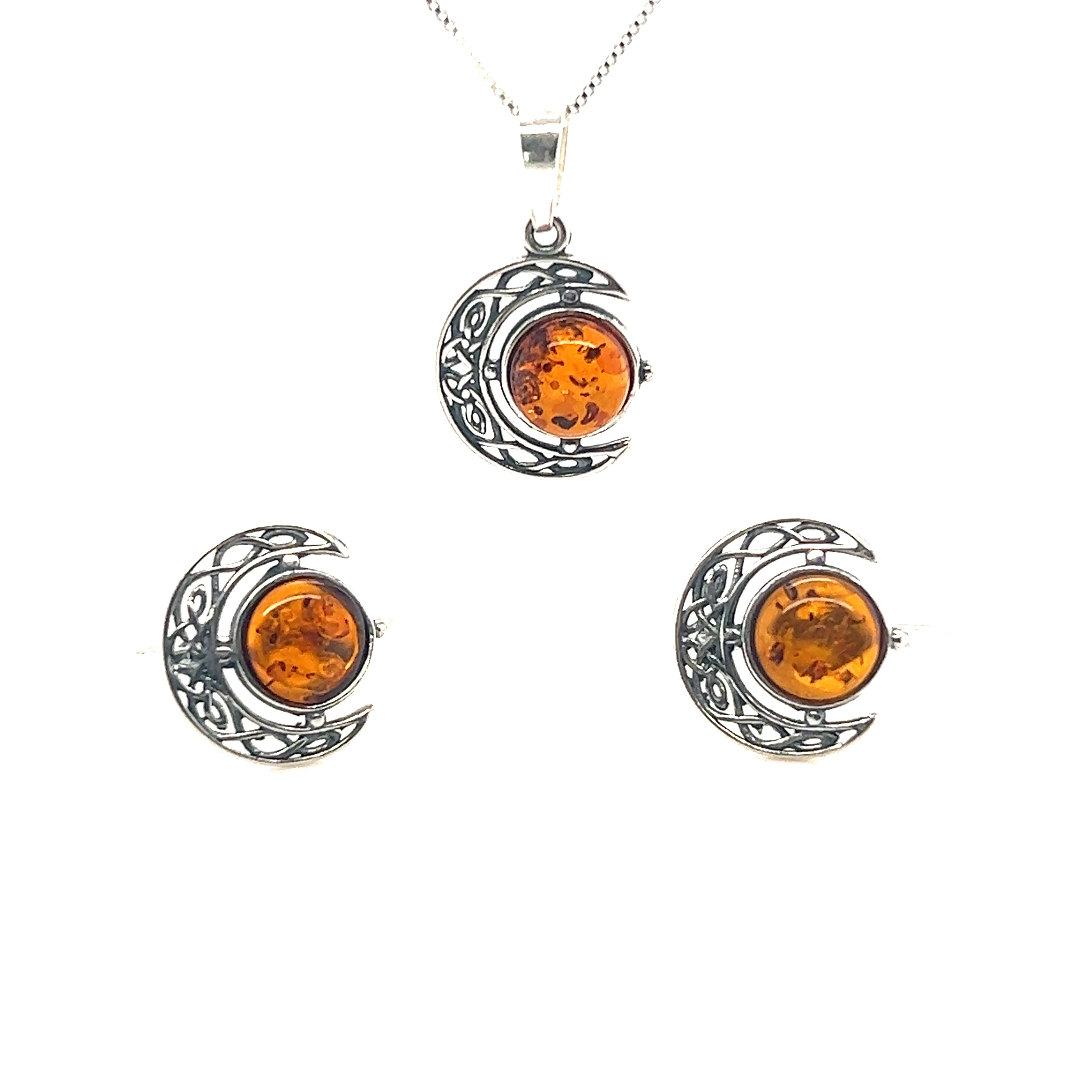 This Celtic Amber Crescent Moon Pendant and earrings set by Super Silver features a stunning crescent moon design adorned with beautiful Baltic amber, inspired by intricate Celtic art.