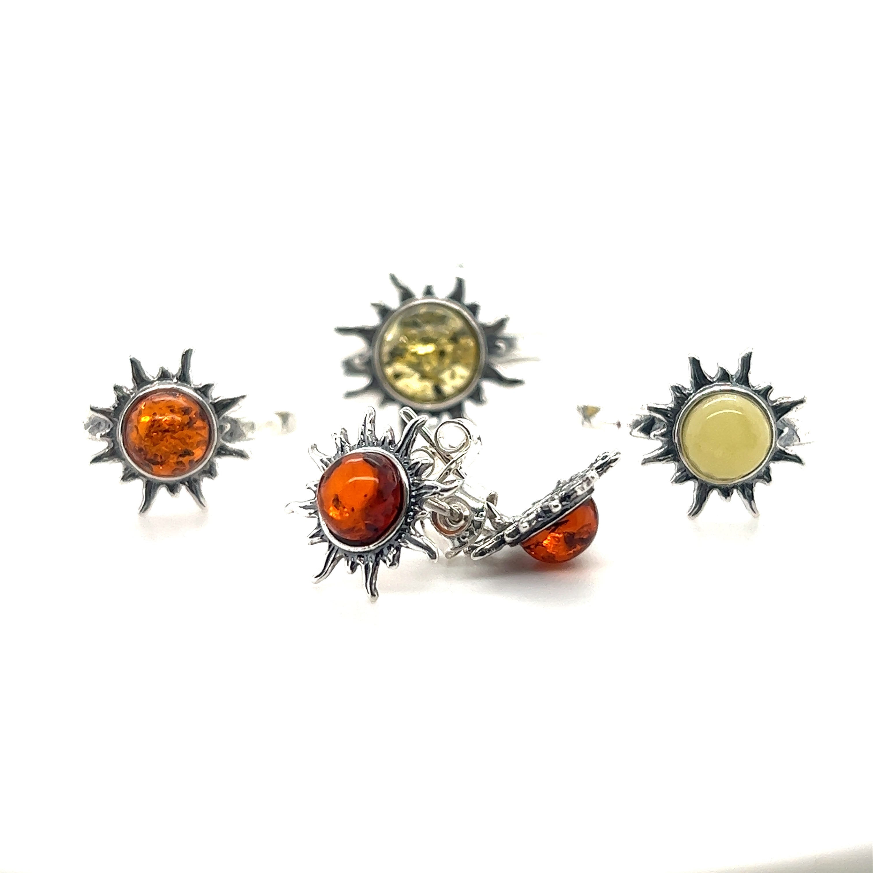 A pair of Super Silver Brilliant Amber Sun Stud Earrings.