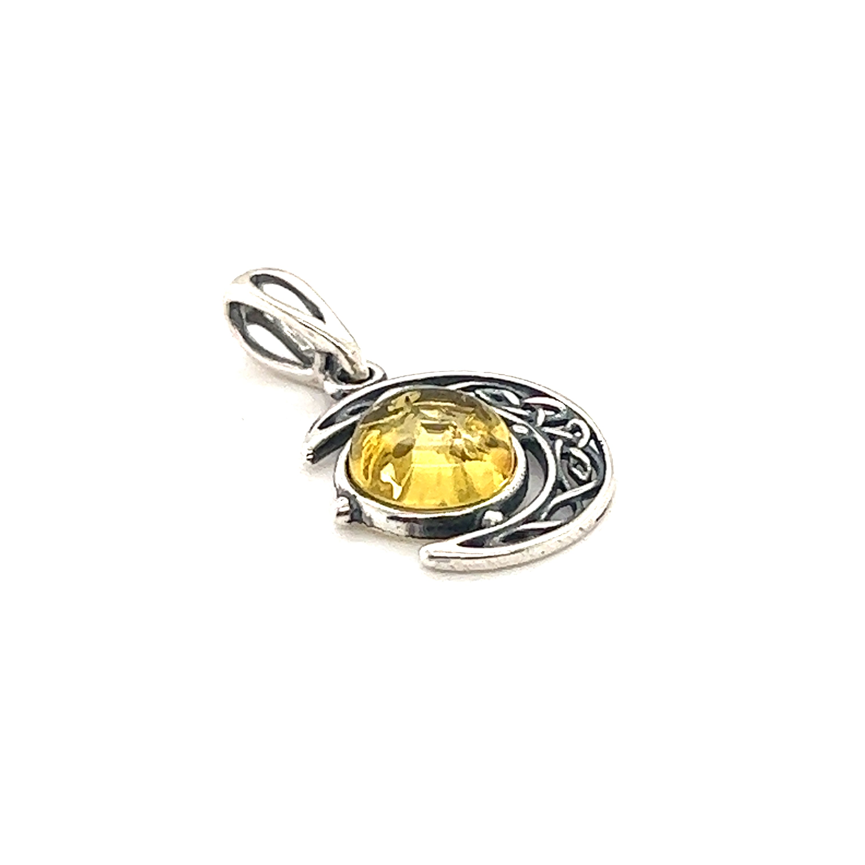 A Super Silver Celtic Amber Crescent Moon Pendant with a yellow citrine stone, accented with Baltic amber.