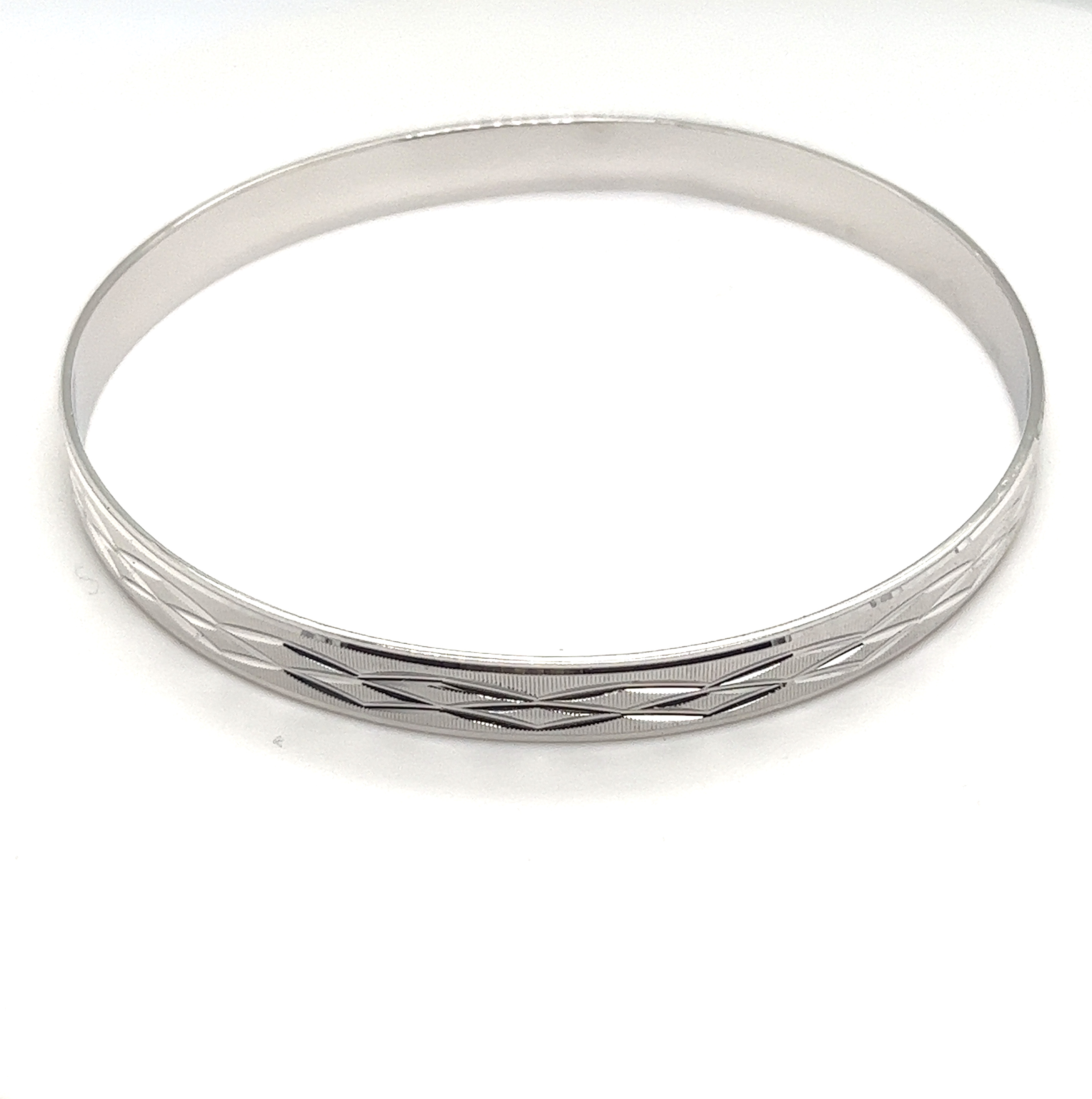A Brilliant Diamond Etched Bangle.
