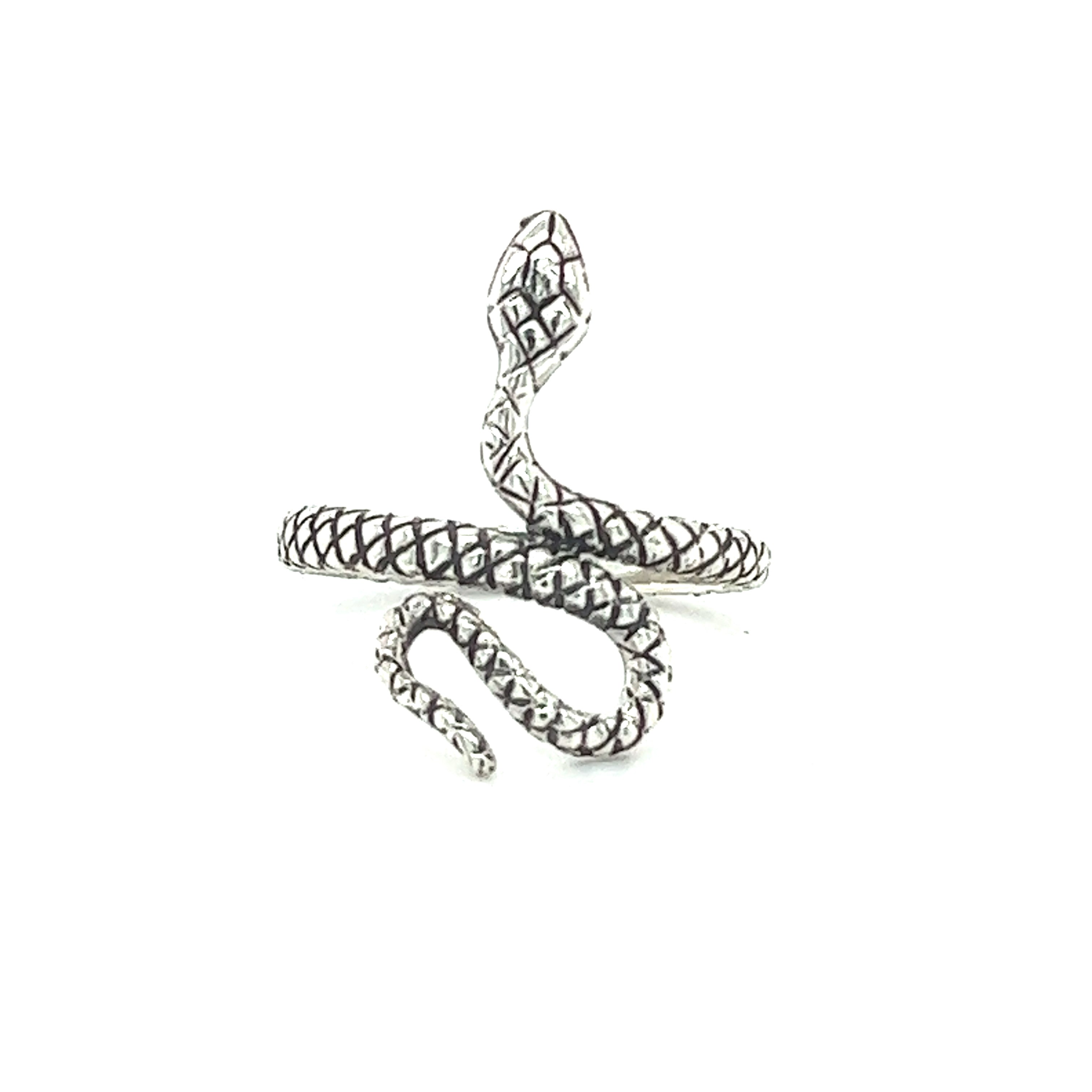 A Textured Winding Snake Ring with intricate patterns and embedded black gemstones, isolated on a white background.