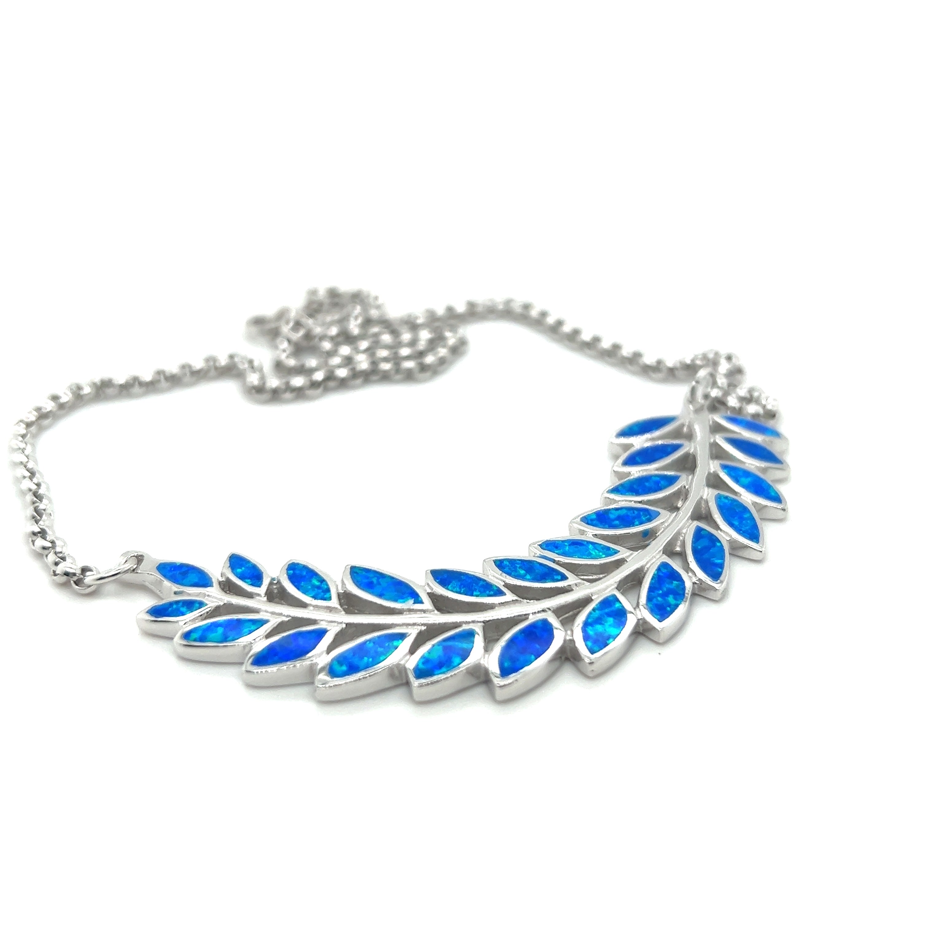 A Stunning Opal Branch Necklace with blue opal leaves in a branch design by Super Silver.