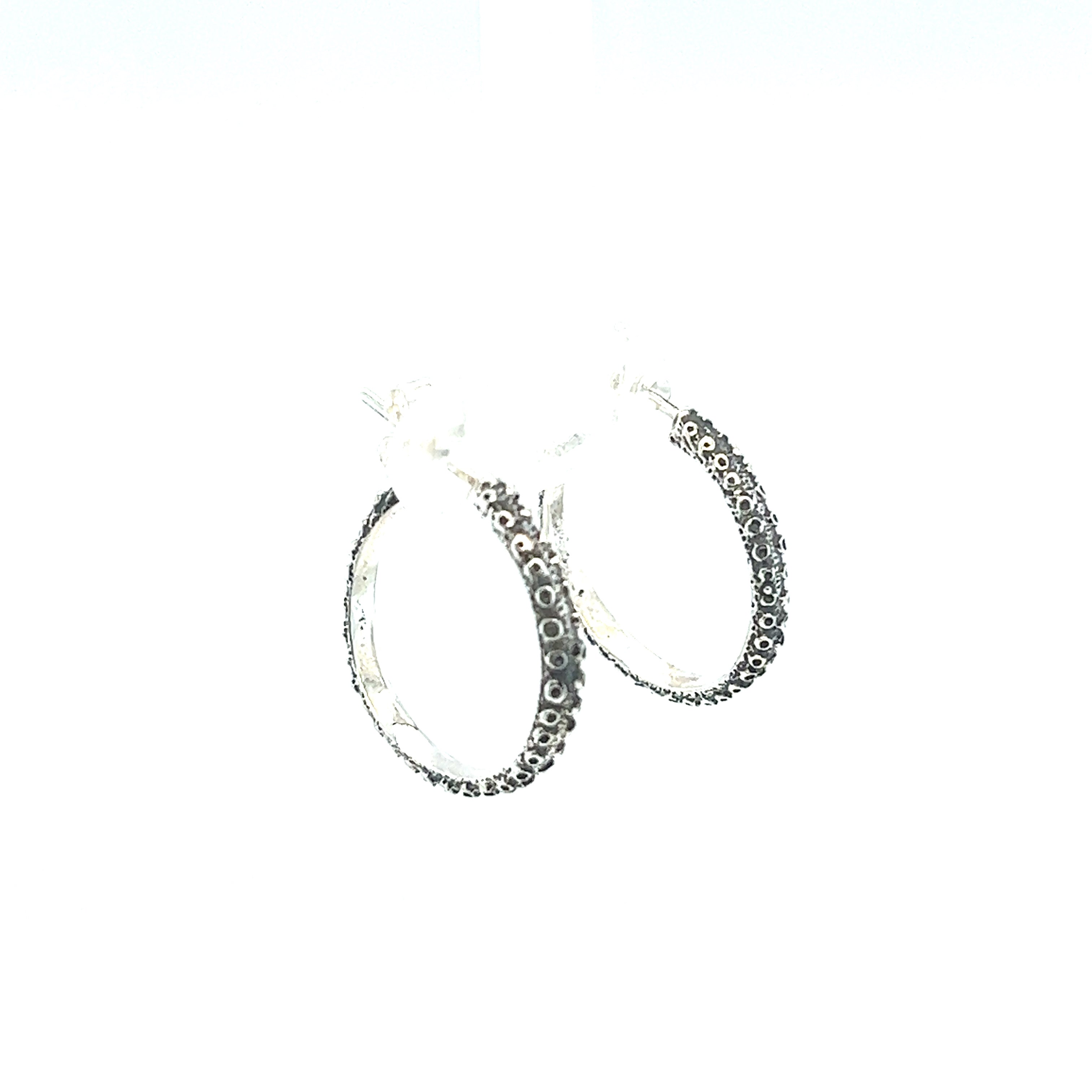 A pair of Handcrafted Octopus Tentacle Hoops by Super Silver with black diamonds and an oxidized finish.