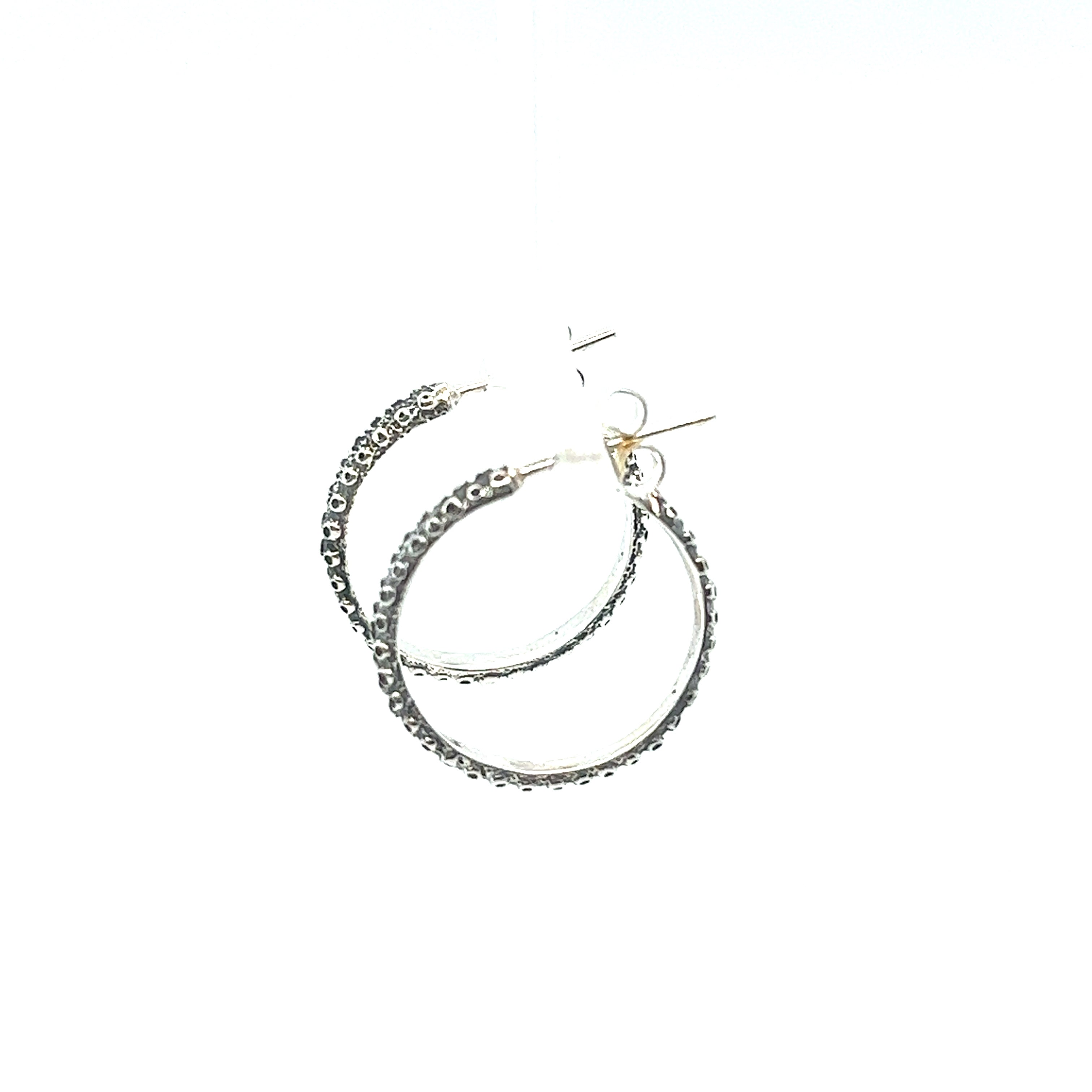 A pair of Super Silver Handcrafted Octopus Tentacle Hoops with an oxidized finish on a white background.