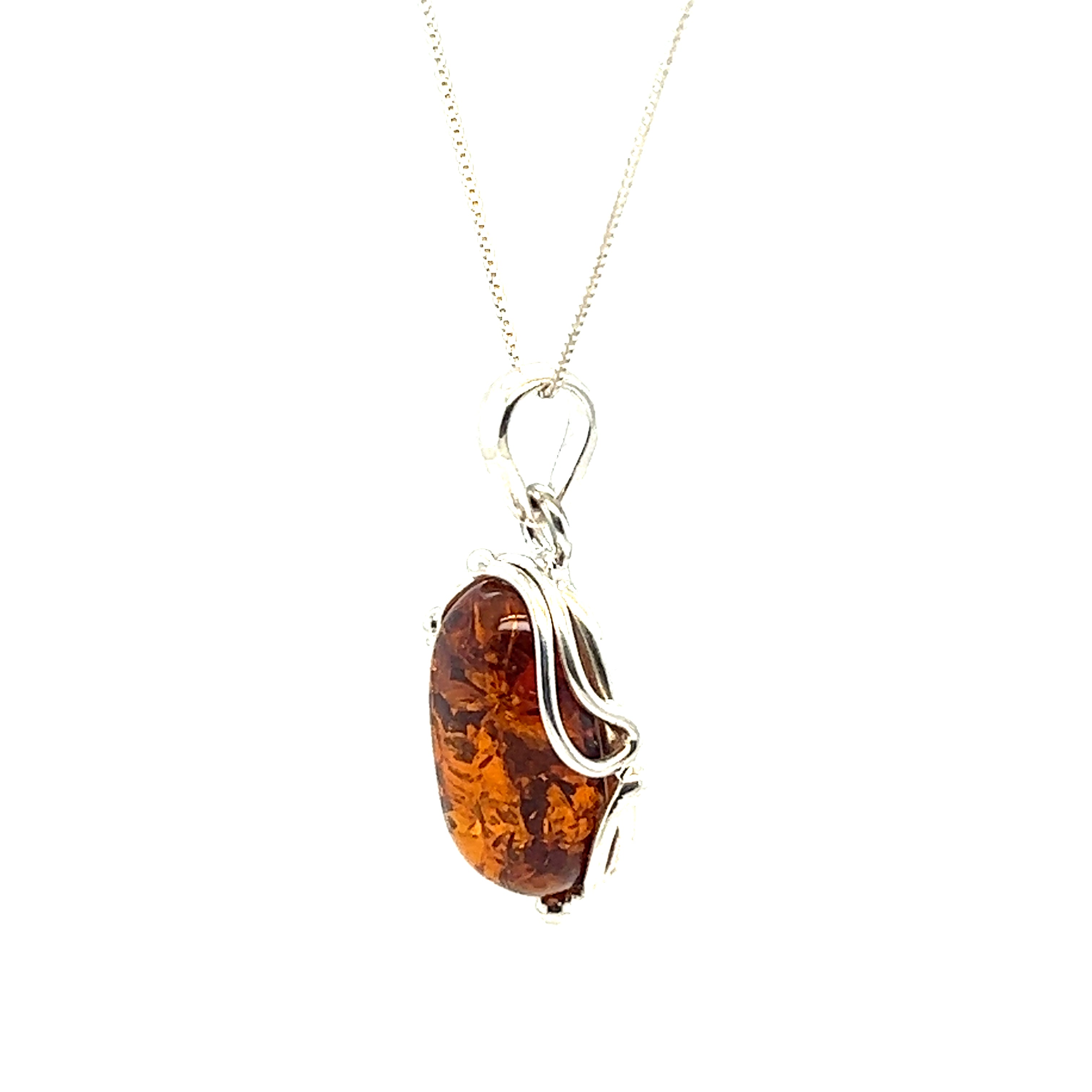 Stunning Amber Oval Pendant adorned with delicate silver vines, by Super Silver.