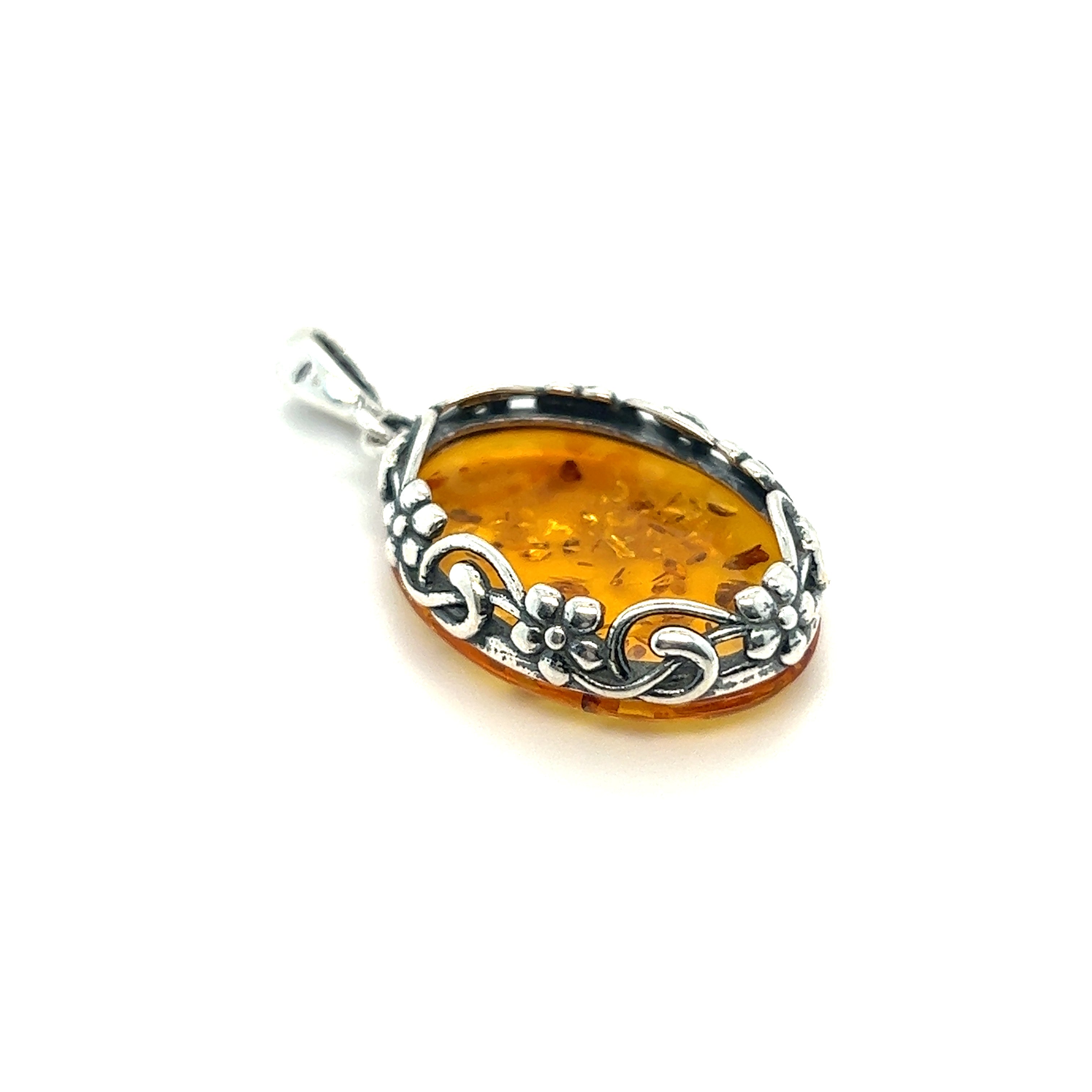 A Cognac Amber Oval Pendant with Floral Border by Super Silver on a white background.